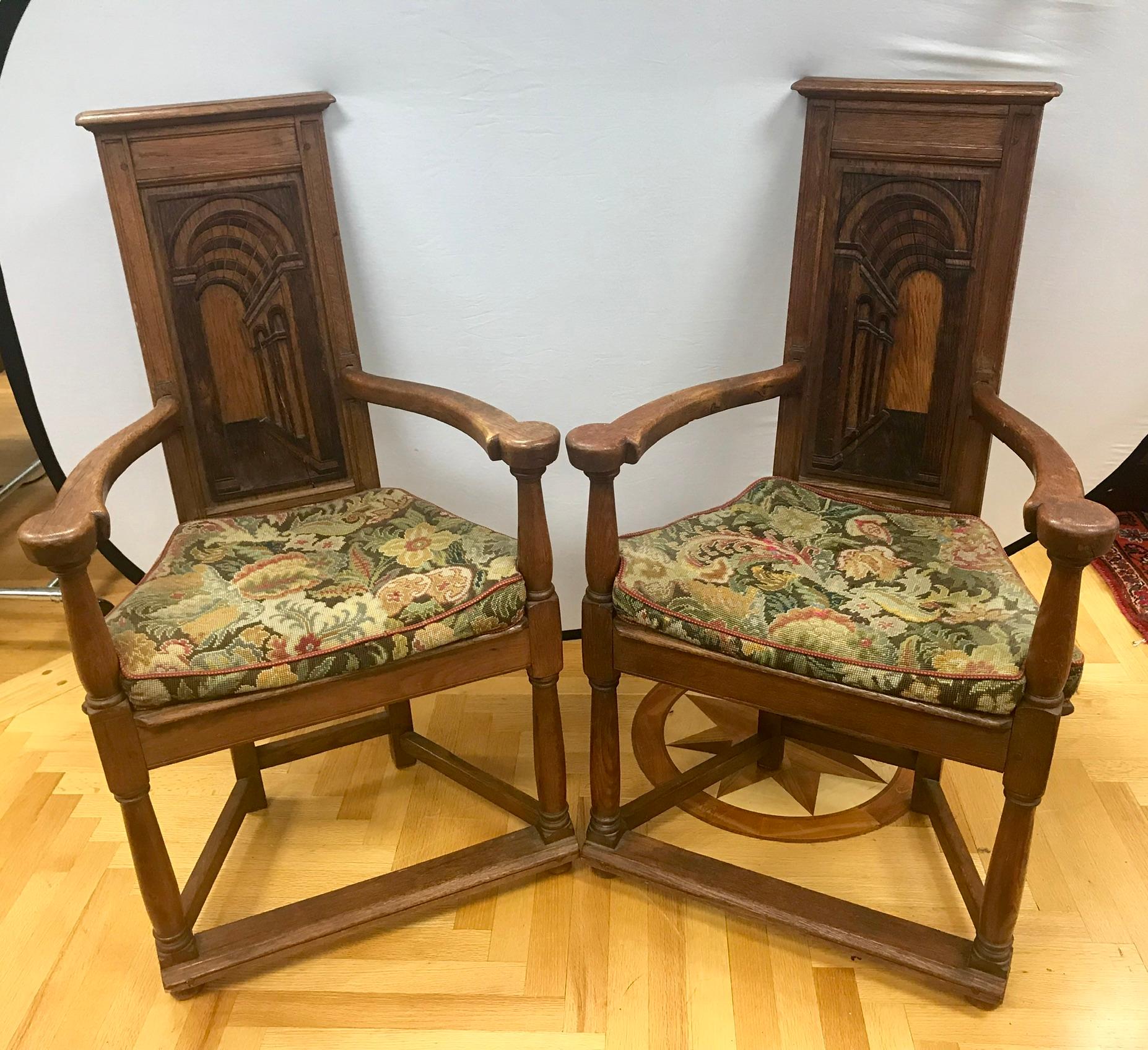 Unusual and elegant antique French Gothic armchairs with original tapestry upholstery.