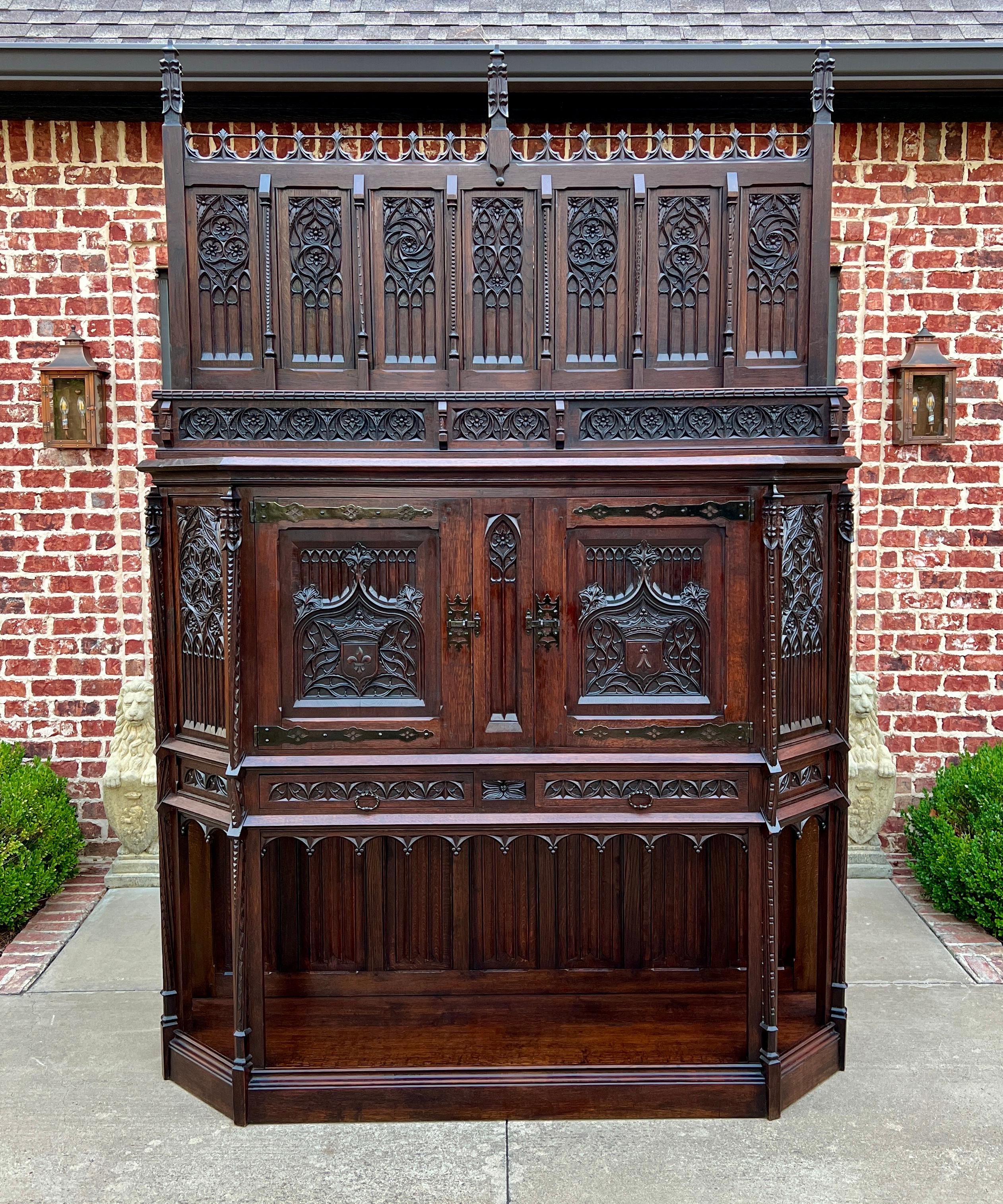 STUNNING ONE-OF-A-KIND Historic Antique French Oak Gothic Sacristy Vestry Altar Wine Cabinet Bar Buffet Bookcase~~Highly Carved~~c. 1860s 

        In 18th and 19th century Europe, sacristy or vestment cabinets were used to store liturgical