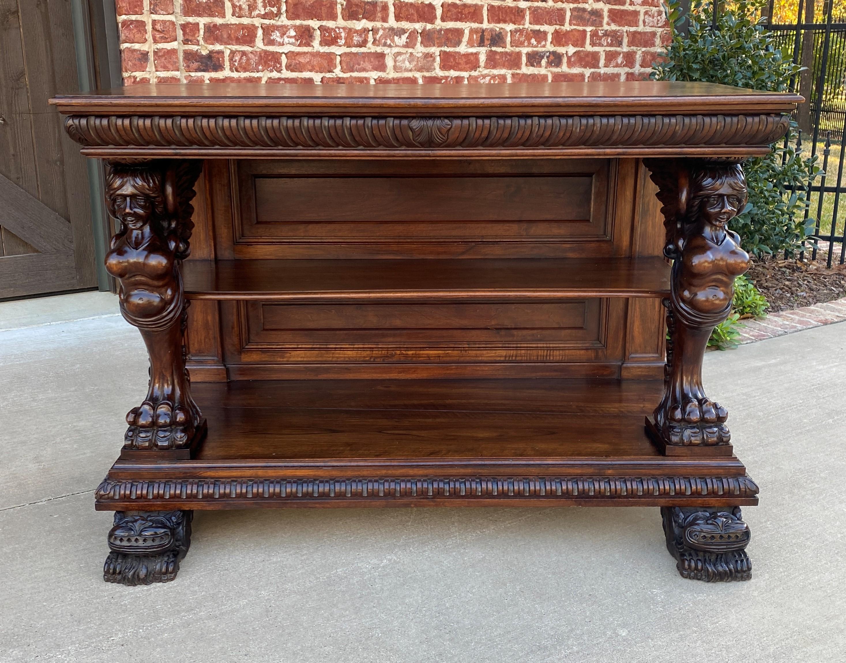 Exquisite antique French Gothic highly carved walnut console, sofa table or sideboard/server~~c. 1880s

Highly carved antique French Gothic walnut console, sofa table, sideboard or server with winged figural supports ,