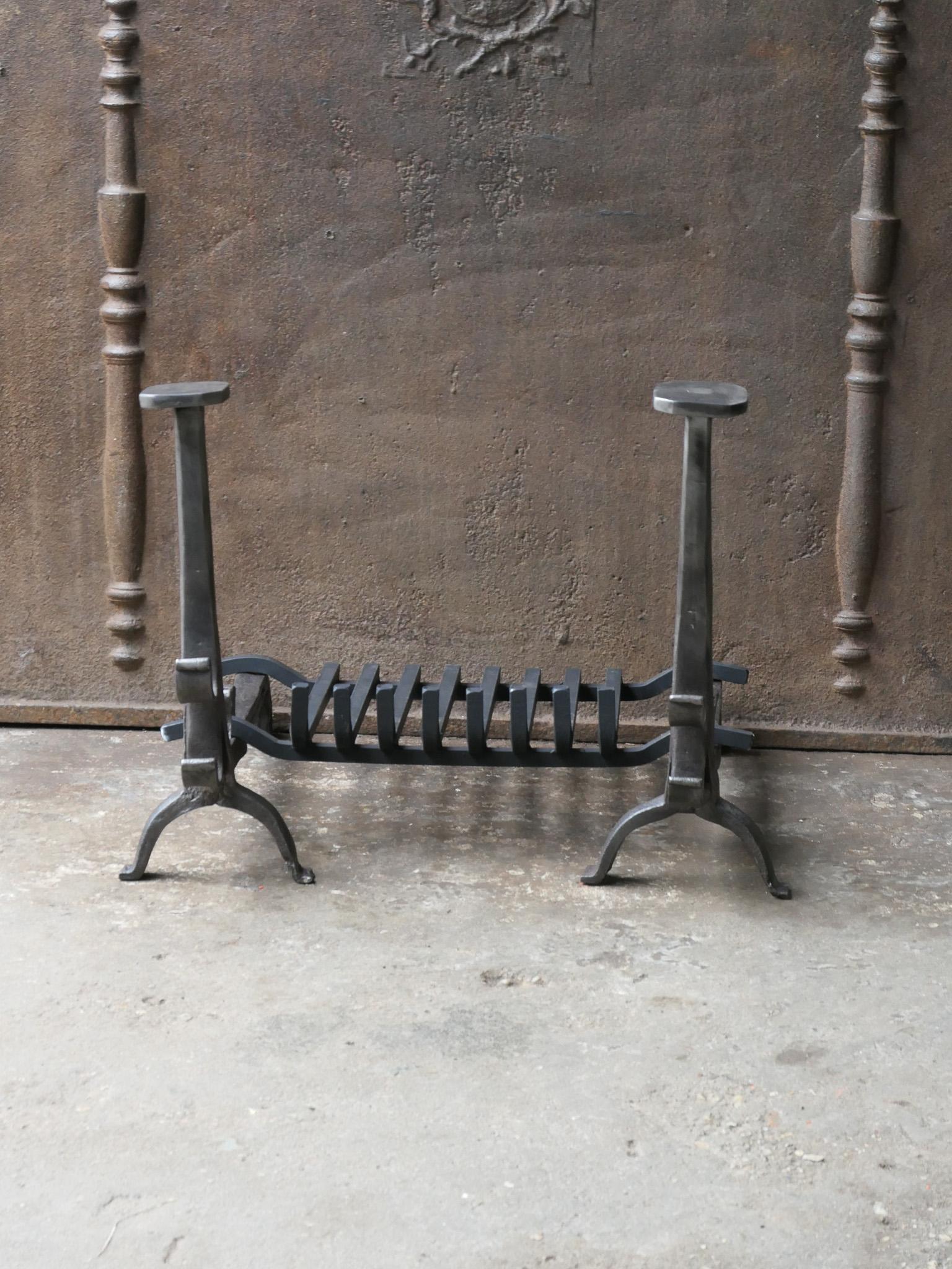 17th - 18th century French Gothic fire grate with period andirons and a recently forged grate. Made of wrought iron. The condition is good. 

The total width at the front of the grate is 60 cm / 23.6 inches.







