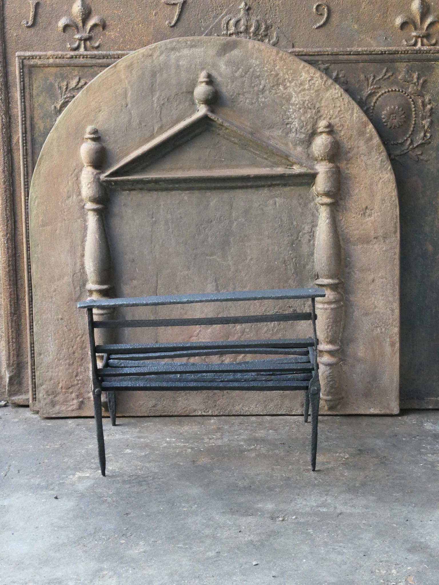 Late 17th or early 18th century French Gothic period fire grate. Hand forged of wrought iron. The condition of the basket is good. 









