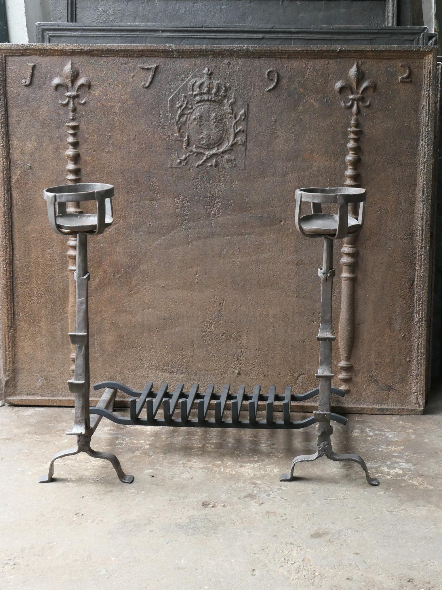 17th century French Gothic fire grate with period andirons and a recently forged grate. Made of wrought iron. The condition is good. 

The total width at the front of the grate is 81 cm / 31.9 inches.








