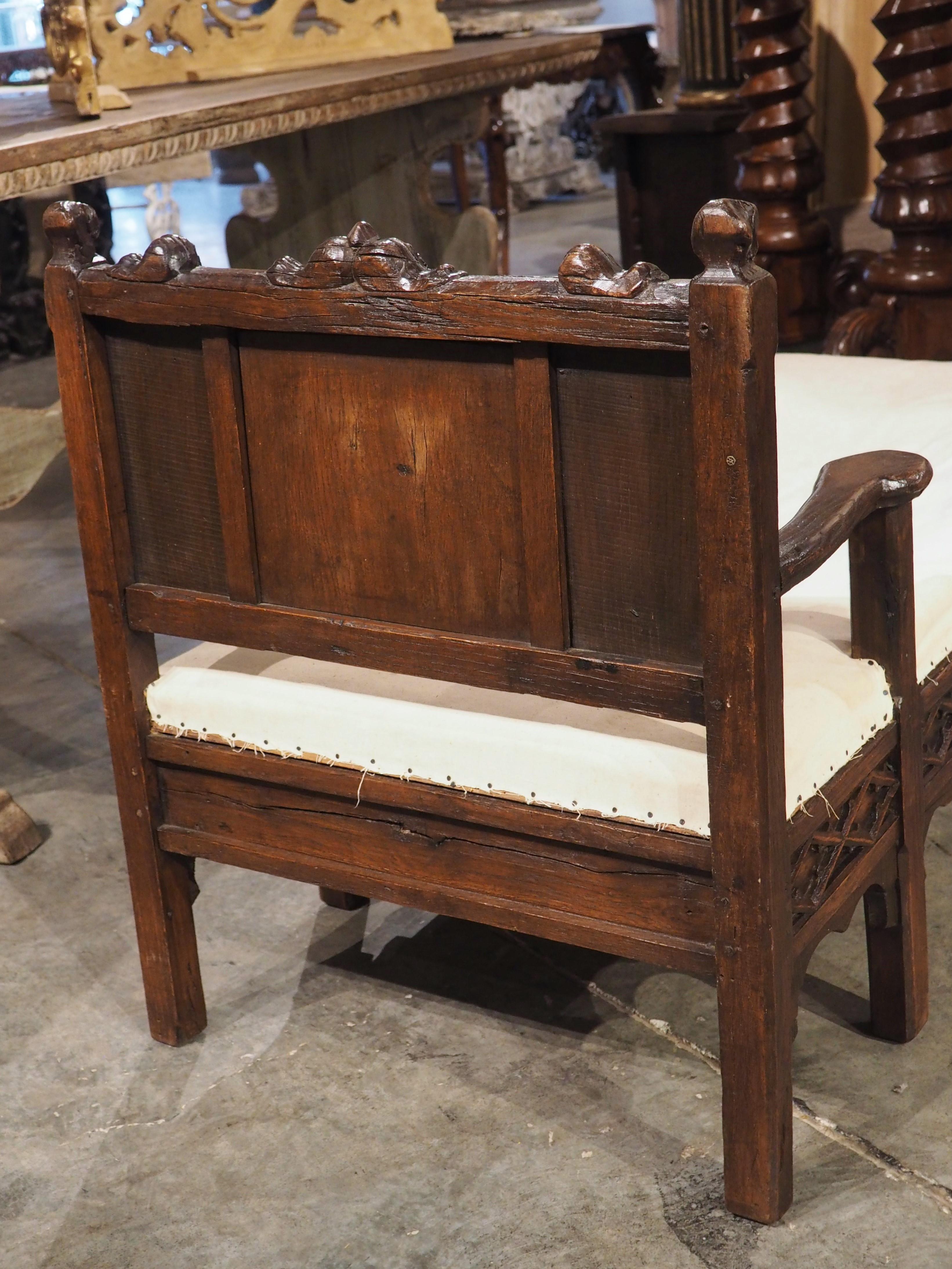 In the 18th and 19th centuries, it was not uncommon for skilled craftsmen to repurpose older wood carvings into their own furniture creations. A French menuisier utilized this technique (circa 1870), incorporating a previously carved chair back and
