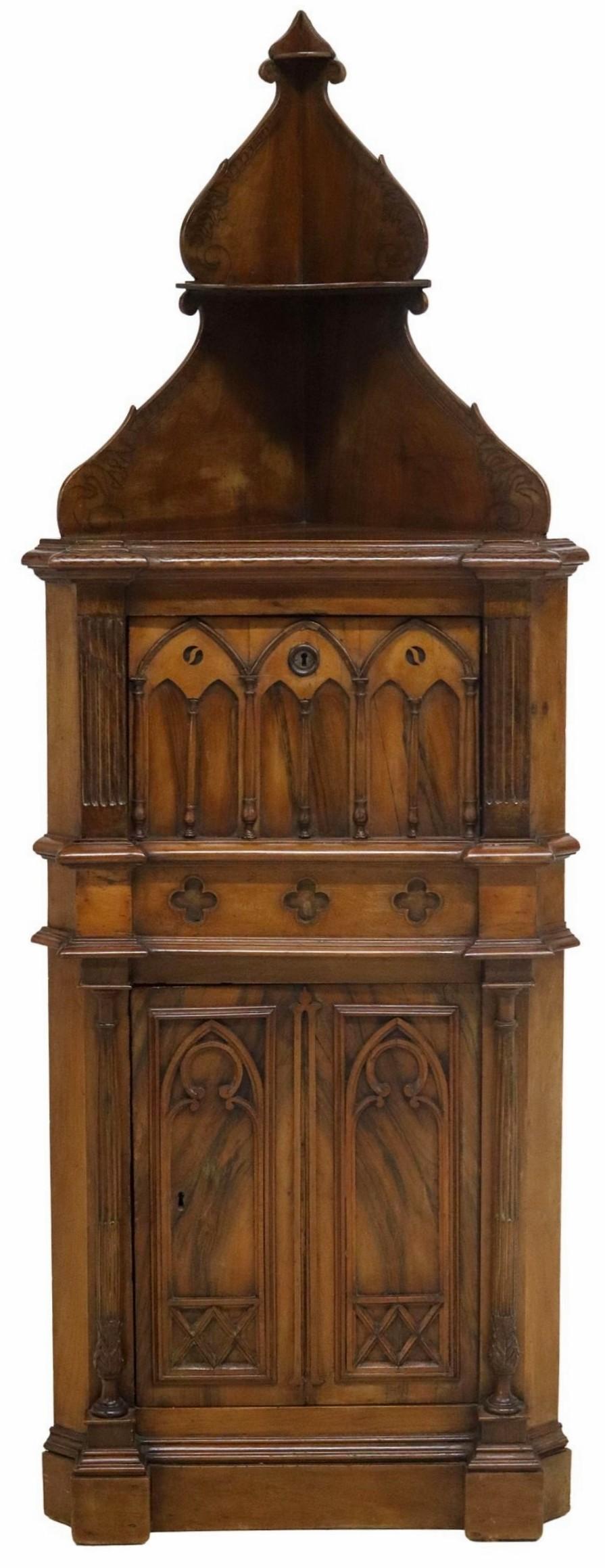 A late 19th century French Gothic Revival carved walnut burlwood tiered shelf-top locking corner cupboard with hidden storage compartment and ornate pyrography decoration.

Hand-crafted in France, circa 1880, almost certainly commissioned for a