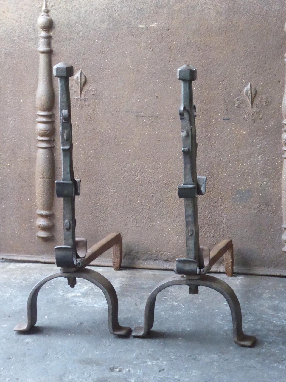 Large 19th century French Gothic style andirons. The andirons are made of wrought iron. They have spit hooks to grill food. The condition is good.







 