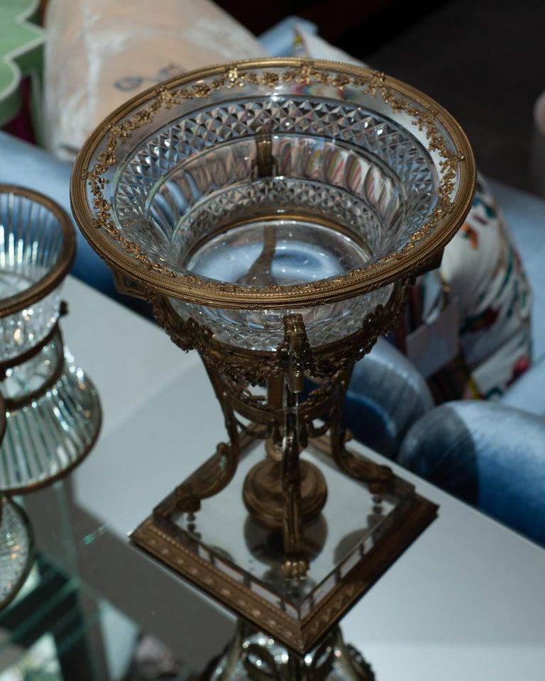 A stunning and large scale antique French cut crystal compote / bowl with ornate bronze trims circa 1880. Measuring 12” tall, this piece makes an equally strong statement in a modern or classical interiors alike. Beautifully crafted, this piece adds