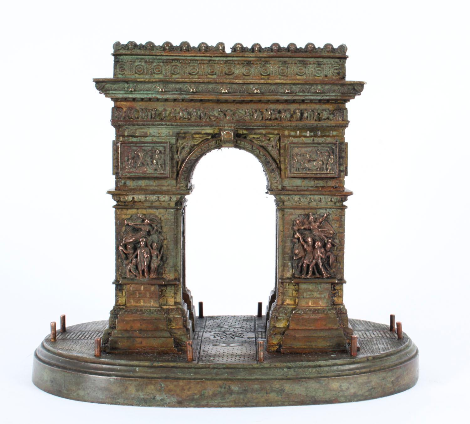 A fine good size French Grand Tour bronze model of the Arc De Triomphe circa 1870 in date.

The beautifully realistic model features the various dramatic high relief panels with a lovely dark brown patina on a oval plinth base.

The monument