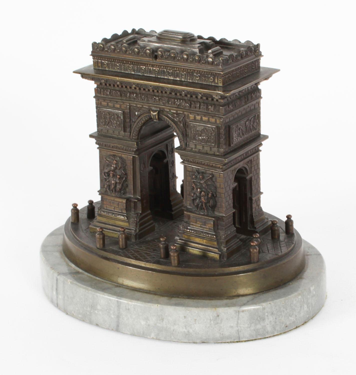 A fine good size French Grand Tour bronze library model of the Arc De Triomphe circa 1860 in date.

The beautifully realistic model features dramatic high relief panels with a lovely dark brown patina on an oval plinth base. The hinged top to of the