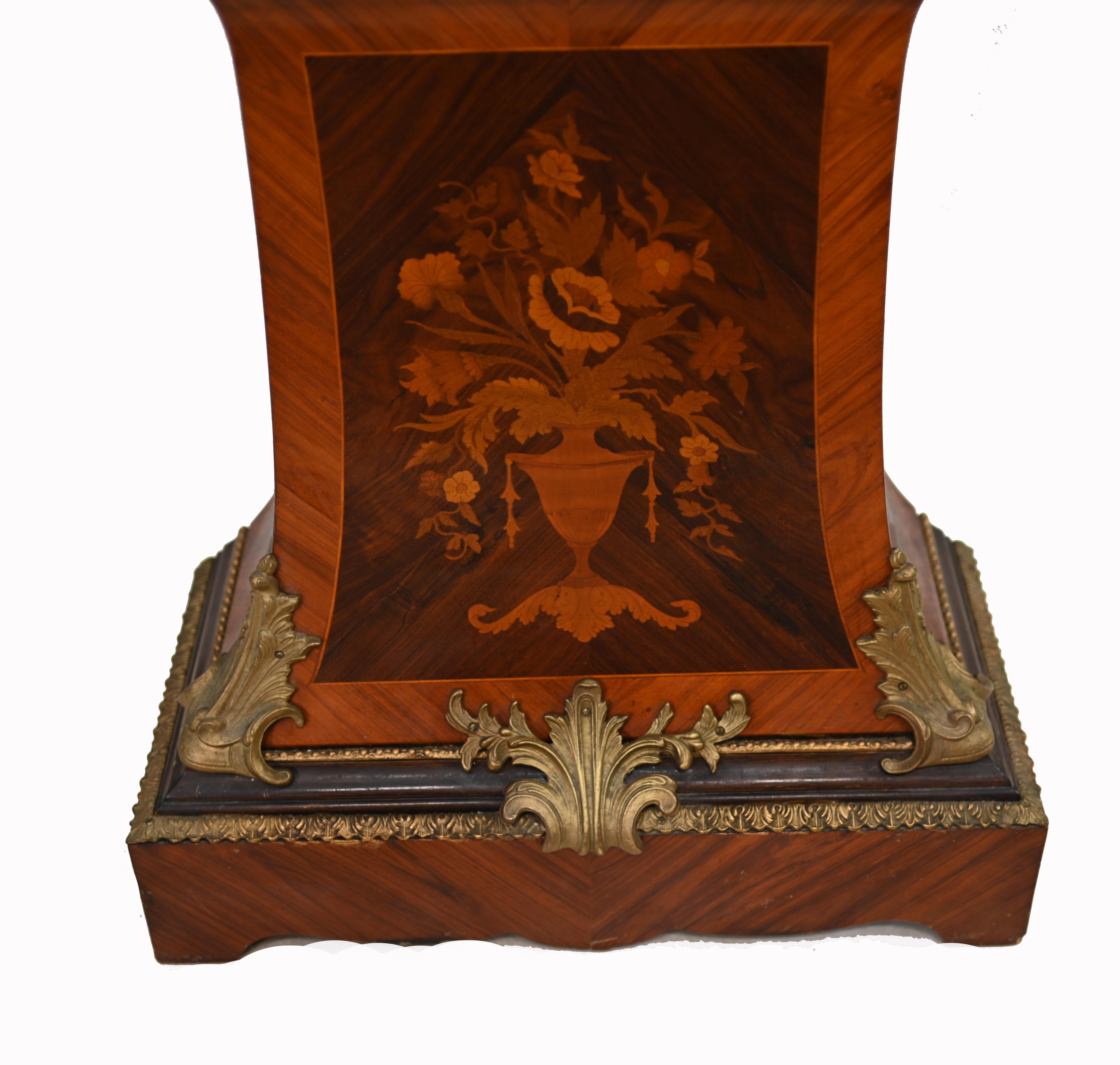 Antique French grandfather clock
French shaped grandfather clock profusely inlaid with marquetry and king wood crossbanded edging embellished with ormolu mounts
The dial has individual enamel hour divisions
We date this to circa 1930
Bought from