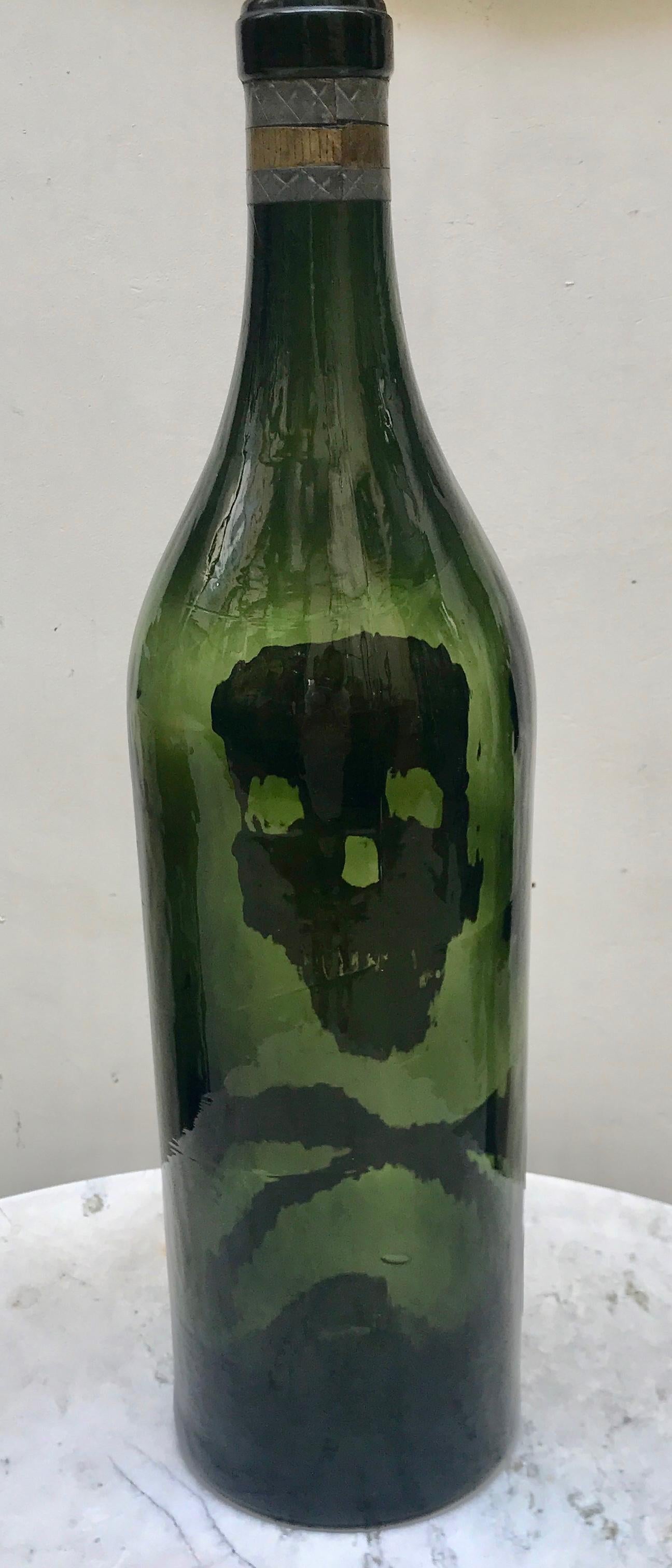 Hand blown French Belle Epoque green glass bottle with hand made applied decoration in lead.
An unusual and interesting find circa 1918