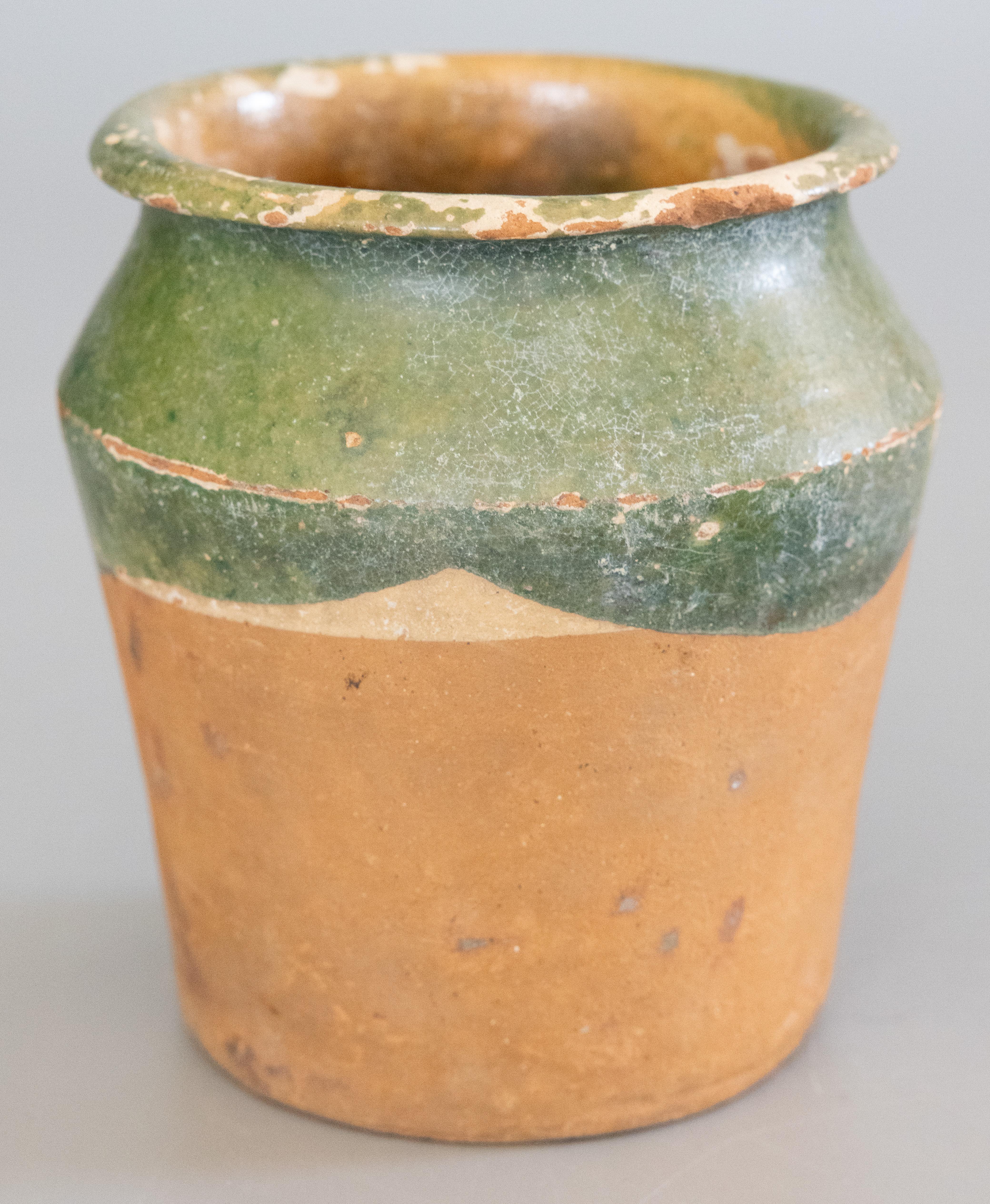 A charming 19th century French confit pot with a wonderful green glaze. Sourced from the South of France, Castelnaudary. These jars were used for storing and preserving cooked meat, and would be beautiful today with a bouquet of flowers or used in