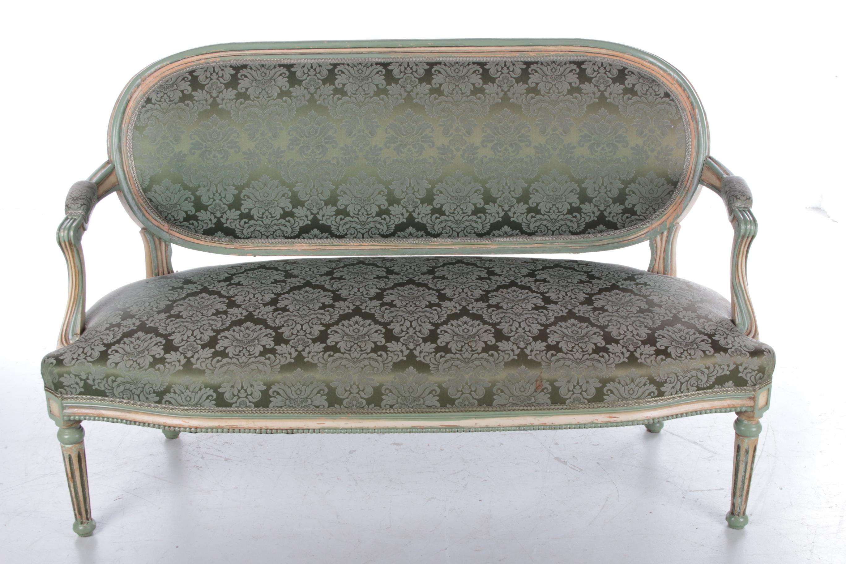 This elegant green sofa is a beautiful example of the classic Louis XVI style. It comes from France and is dated around 1850.

The sofa has a beautiful sea green color in both the upholstery and the details. The subtle curls and other details in