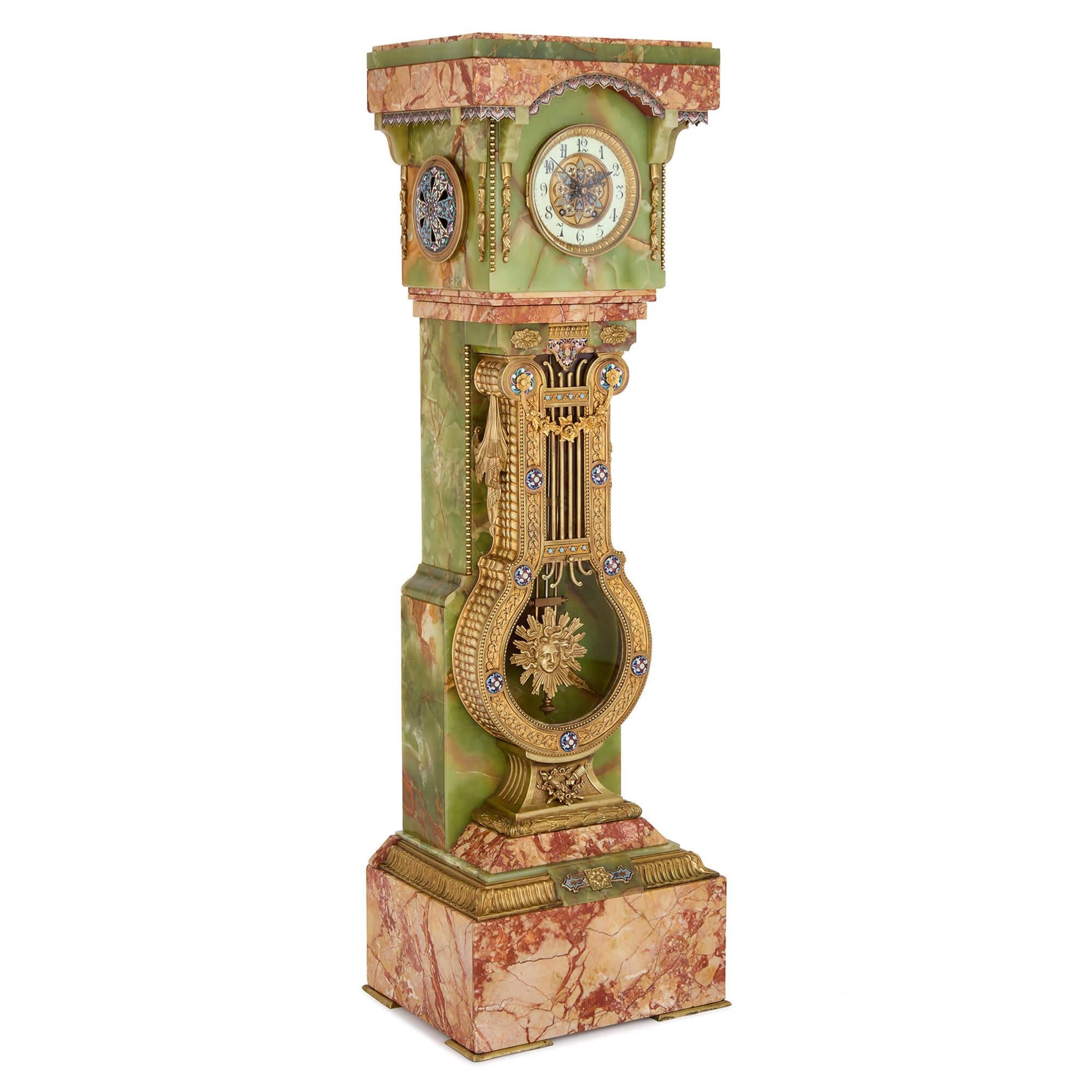 Antique French Green Onyx Champlevé Enamel Marble Ormolu Pedestal Clock 
French, Late 19th Century 
Height 136 cm, Width 41 cm, Depth 33 cm

An impressive French pedestal clock in green onyx, marble, and cloisonné enamel, this work exemplifies the