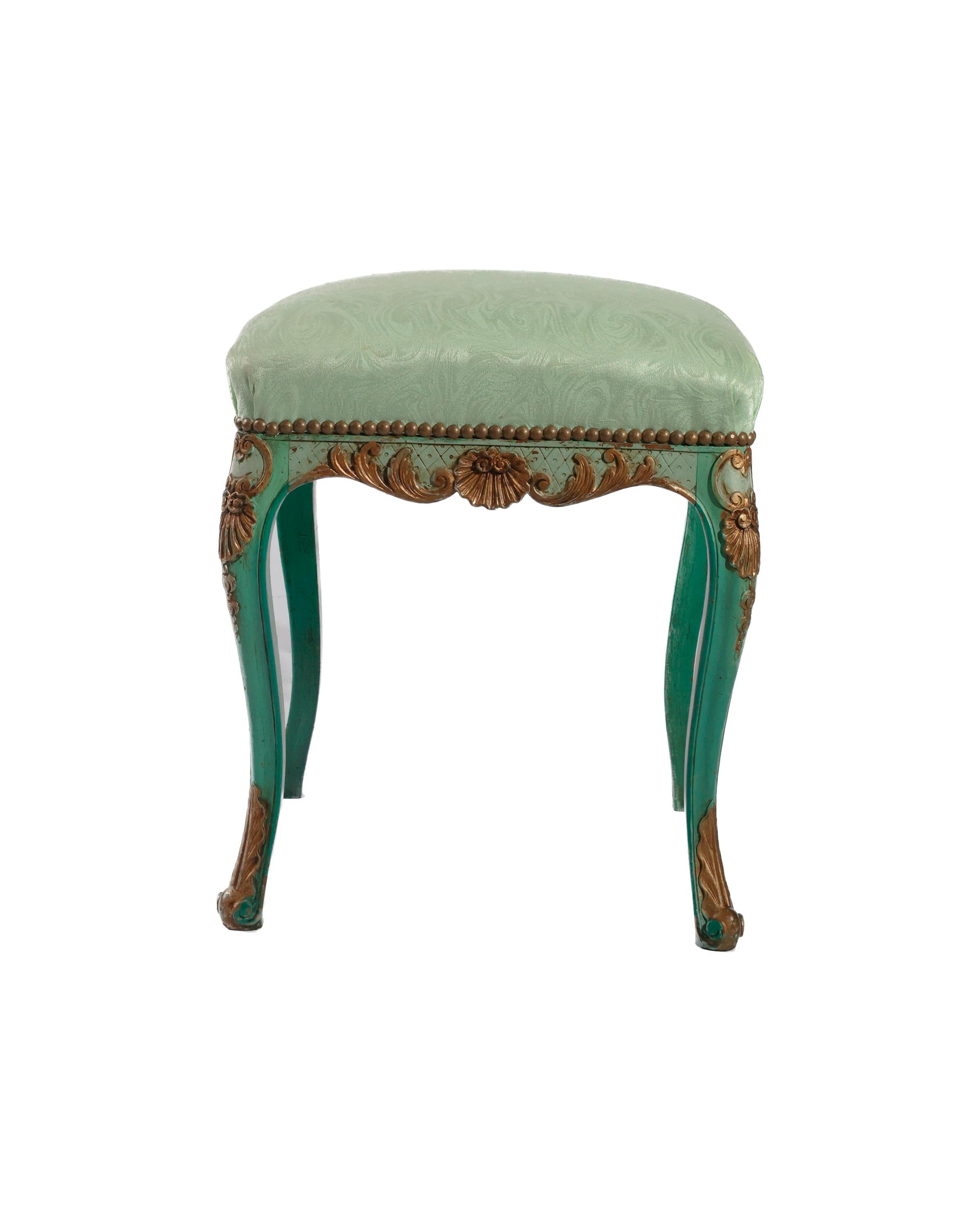 French antique stool in a beautiful green enamel with fine gilt details. The stool is upholstered in a green silk damask. Purchased in Lyon, France, This uniquely elegant stool would be a lovely addition to a dressing room, powder room vanity, or