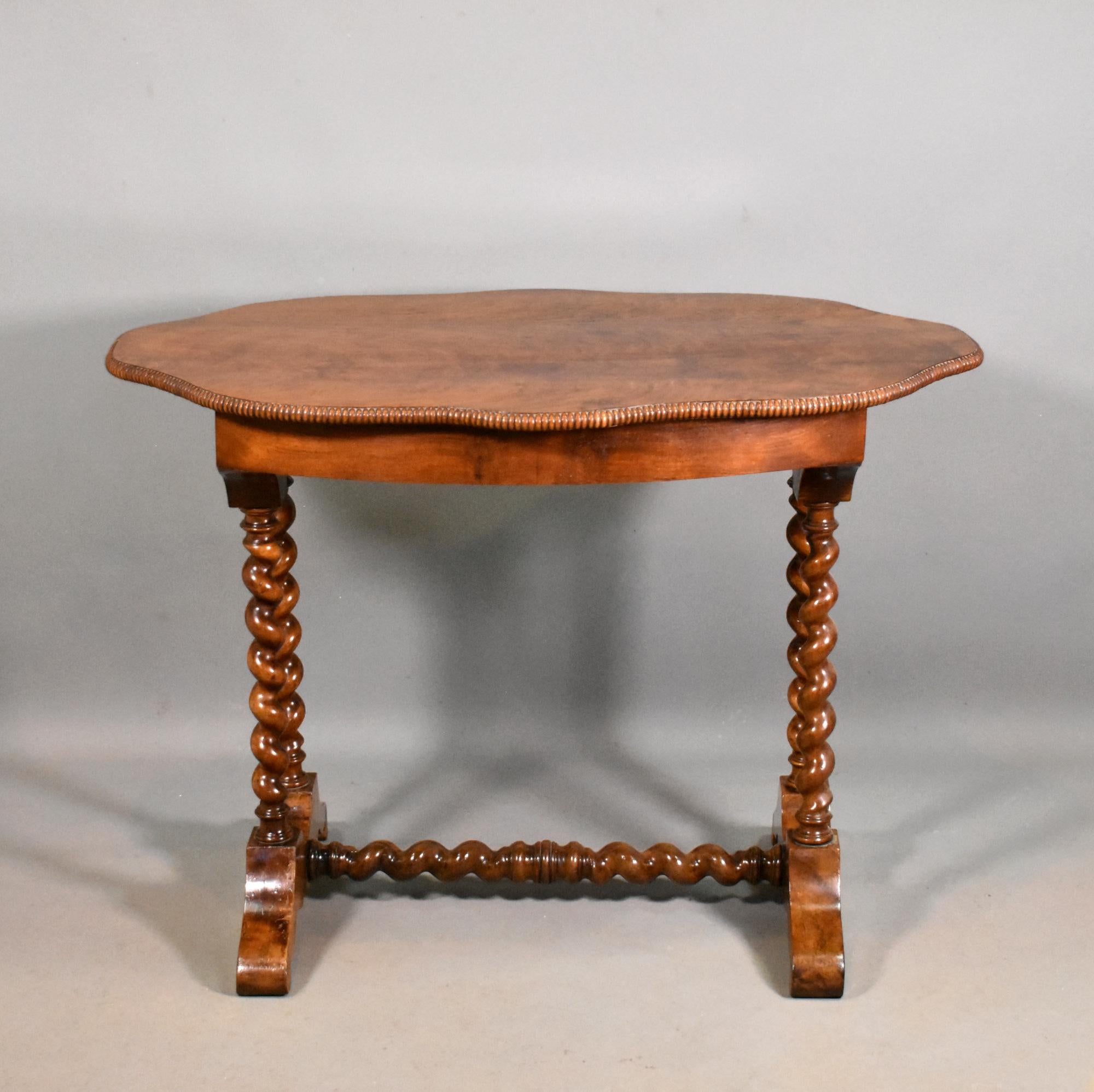 Antique French Gueridon Centre Table in Walnut 

This Antique French Walnut Gueridon Centre Table features a striking book-matched wild grain walnut top with a shaped and moulded outer edge. 

The table stands on beautifully turned barley twist legs