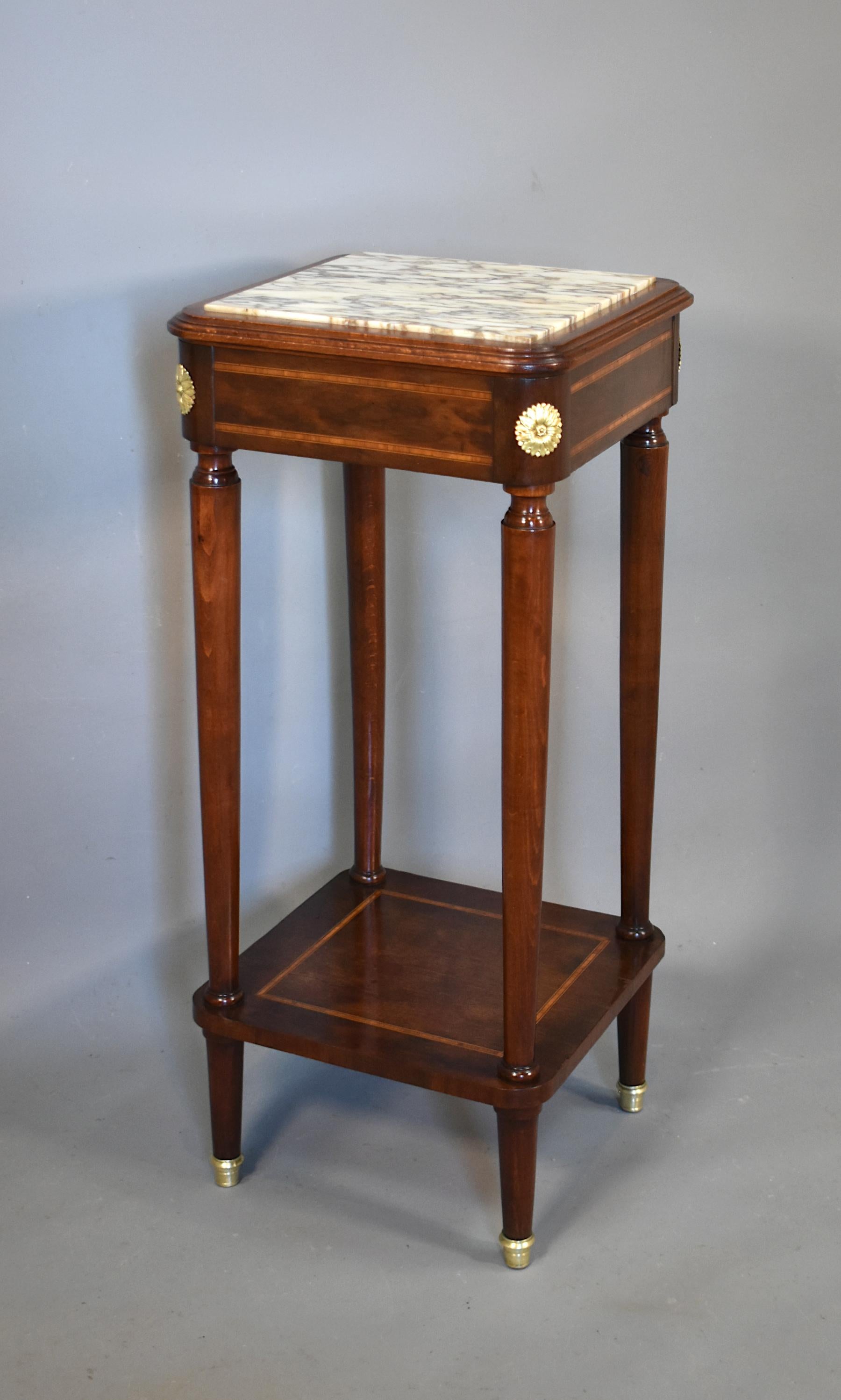 Antique French Gueridon side table sellette

This pretty mahogany gueridon side table features a stunning variegated marble top set into a moulded outer edging. 

The frieze is decorated all around with boxwood, ebony and satinwood banding and