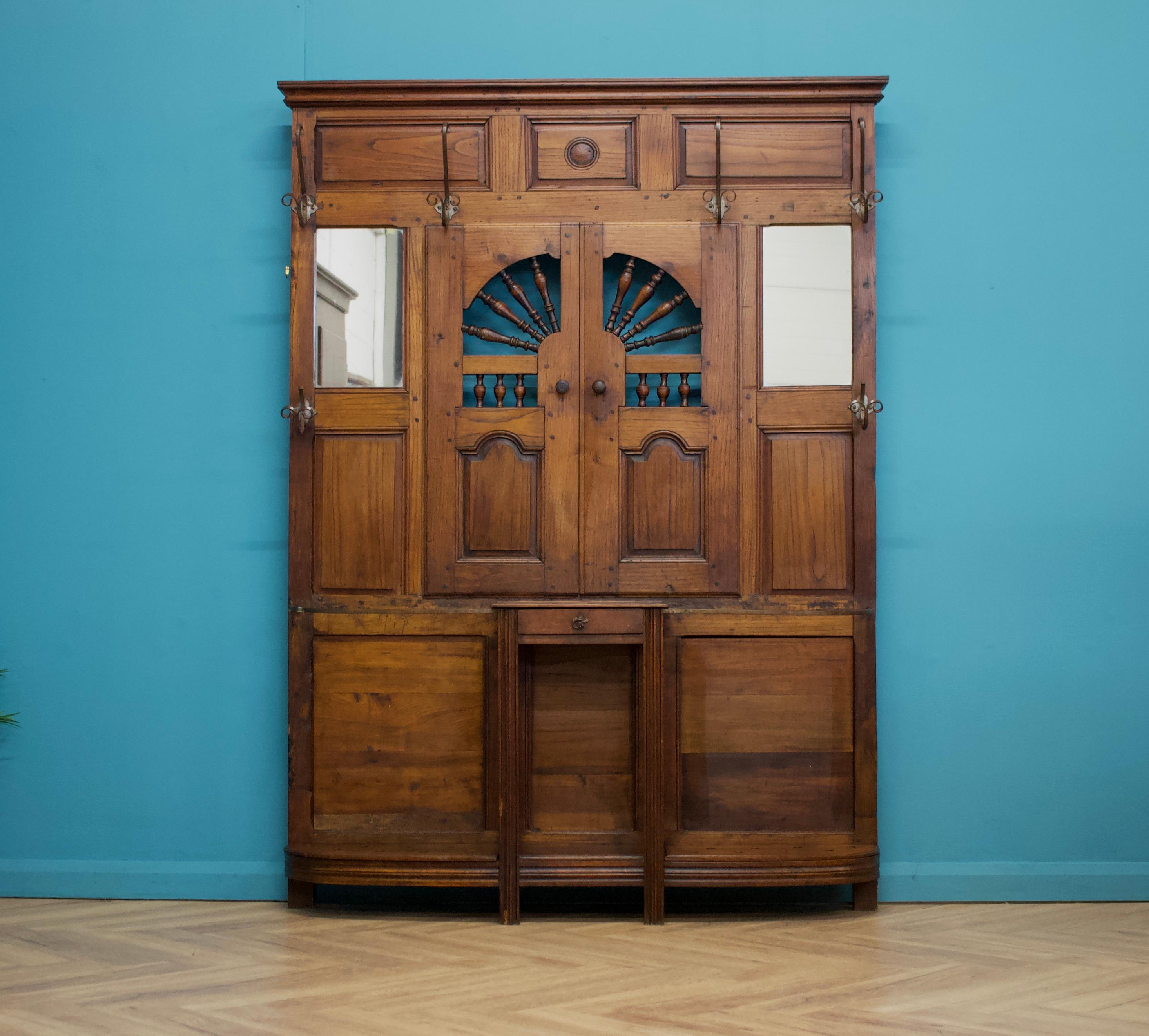 A 19th century antique large French hall stand

There are six large coat hooks, a table with a drawer and umbrella stand