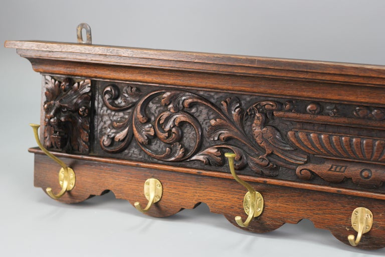 https://a.1stdibscdn.com/antique-french-hand-carved-oak-and-brass-wall-coat-rack-with-lion-heads-1900s-for-sale-picture-3/f_42681/f_272914521644364992285/antique_coat_rack_lion_3__master.jpg?width=768
