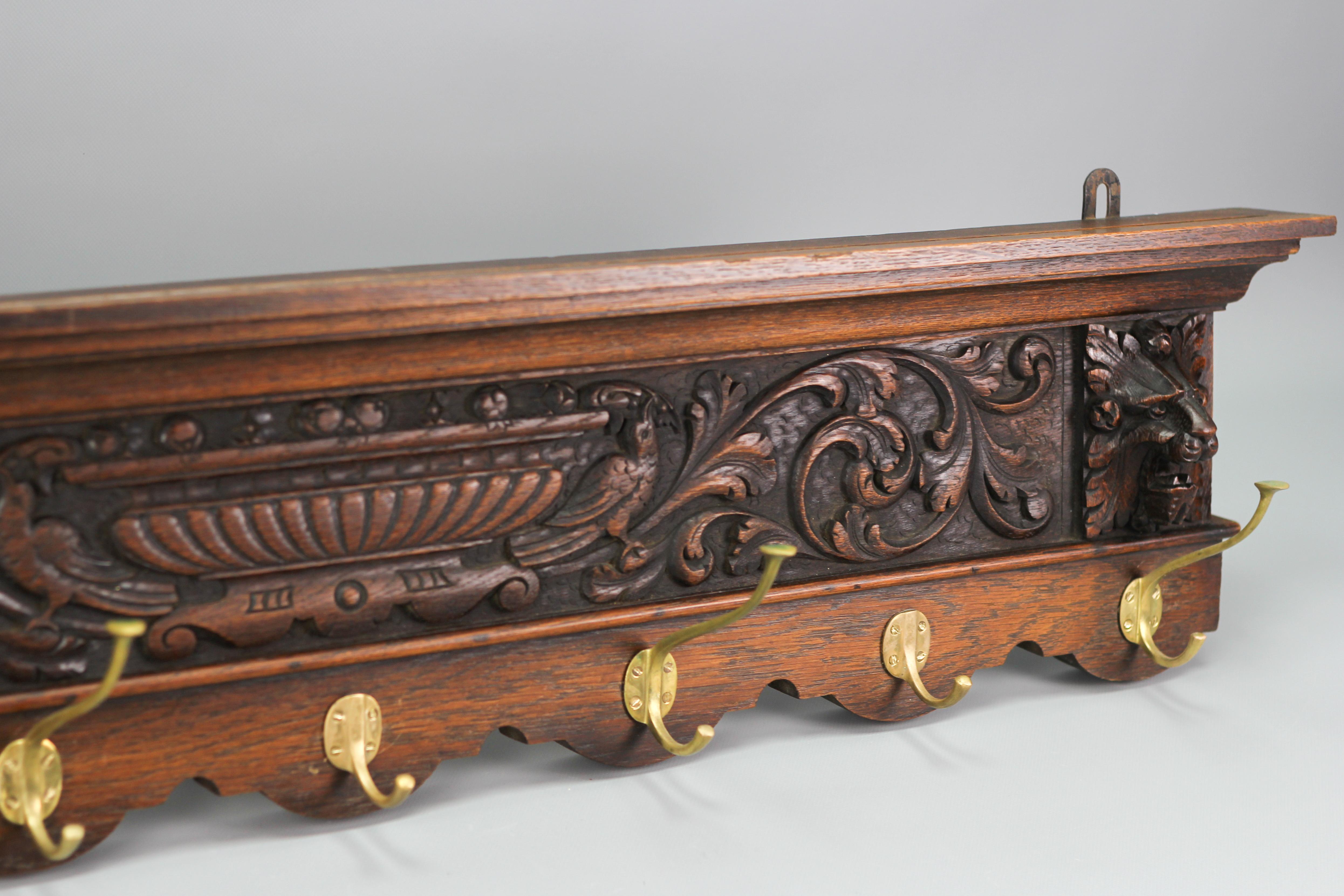 Early 20th Century Antique French Hand-Carved Oak and Brass Wall Coat Rack with Lion Heads, 1900s For Sale