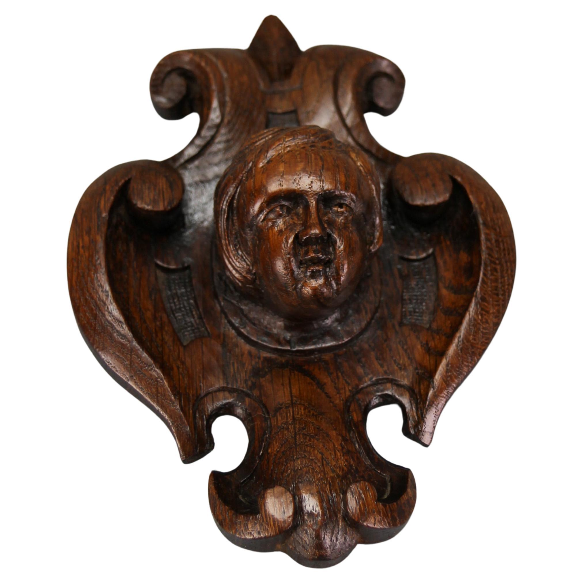 Antique French Hand-Carved Oak Wood Wall Plaque with Cherub's Head, ca. 1900 For Sale