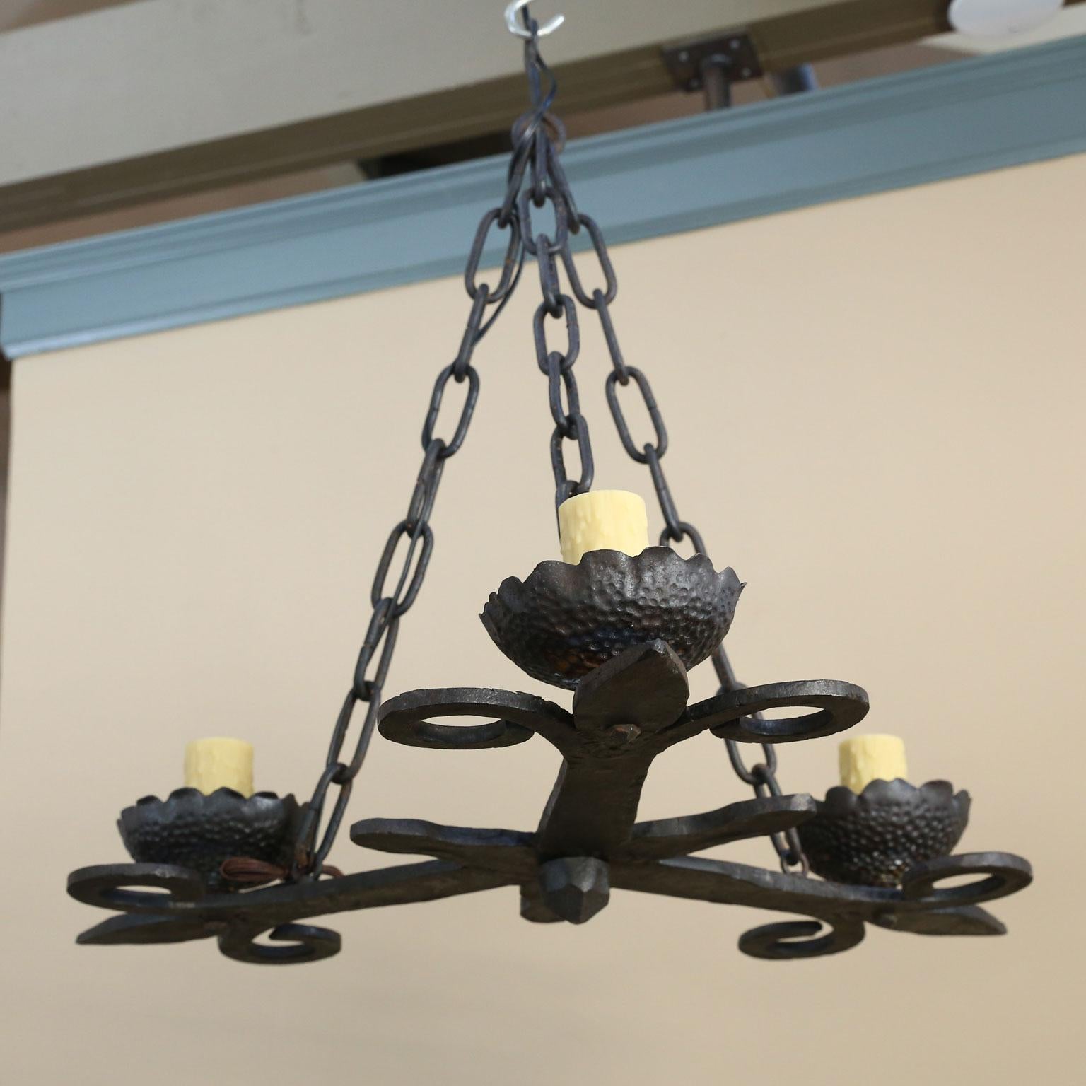 Country rustic style three-light chandelier. Highly detailed hand-forging. From France circa 1900. Re-wired for the USA with three medium based sockets. UL parts. Includes four feet of chain. Height is measured from the meeting point of the three