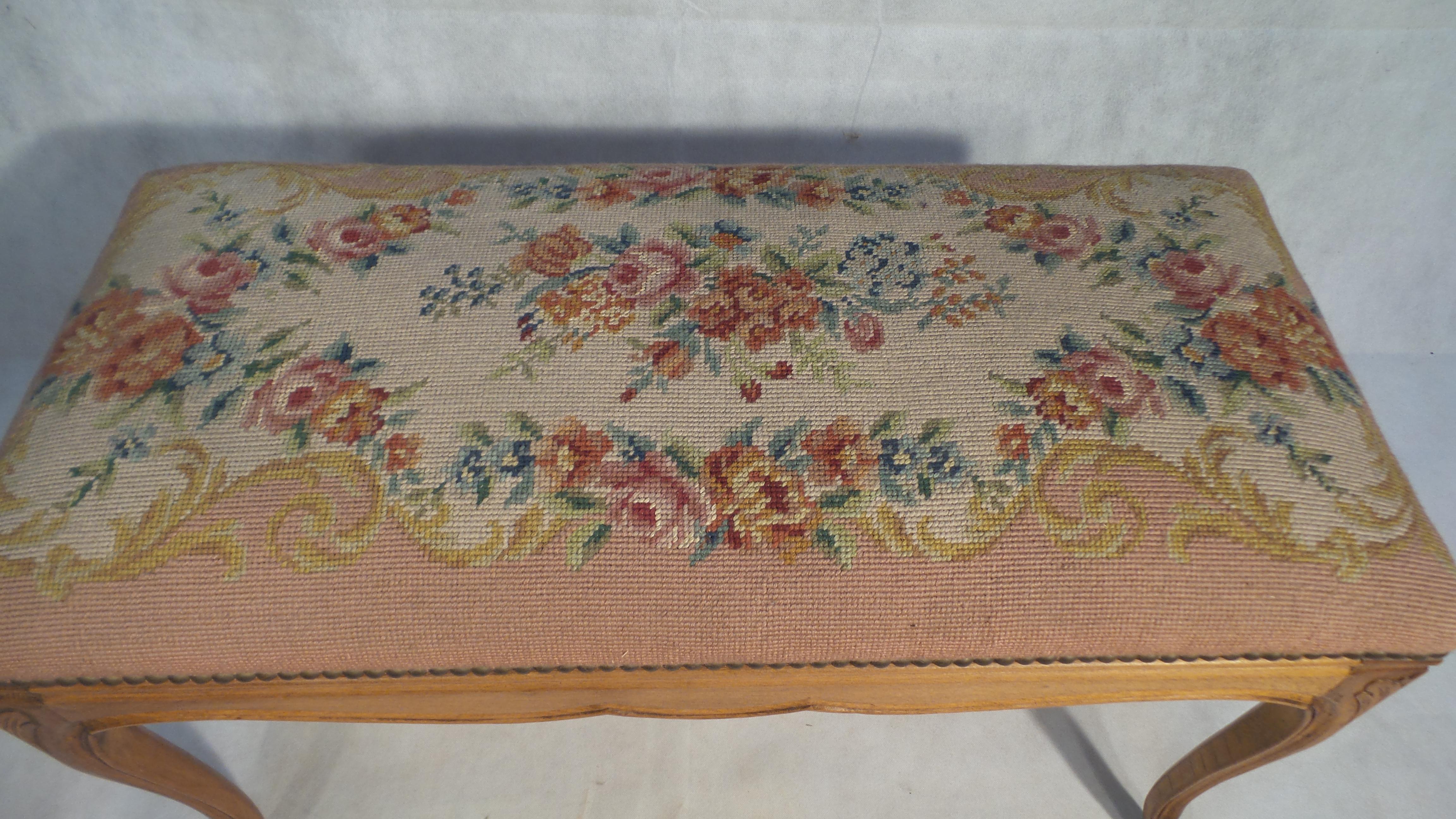 An outstanding example of this timeless example of French chic. This beautiful footstool has a tapestry seat with an elegant oak frame

The footstools background is in pale pink whilst the detailed tapestry design is in delicate pastels.
The