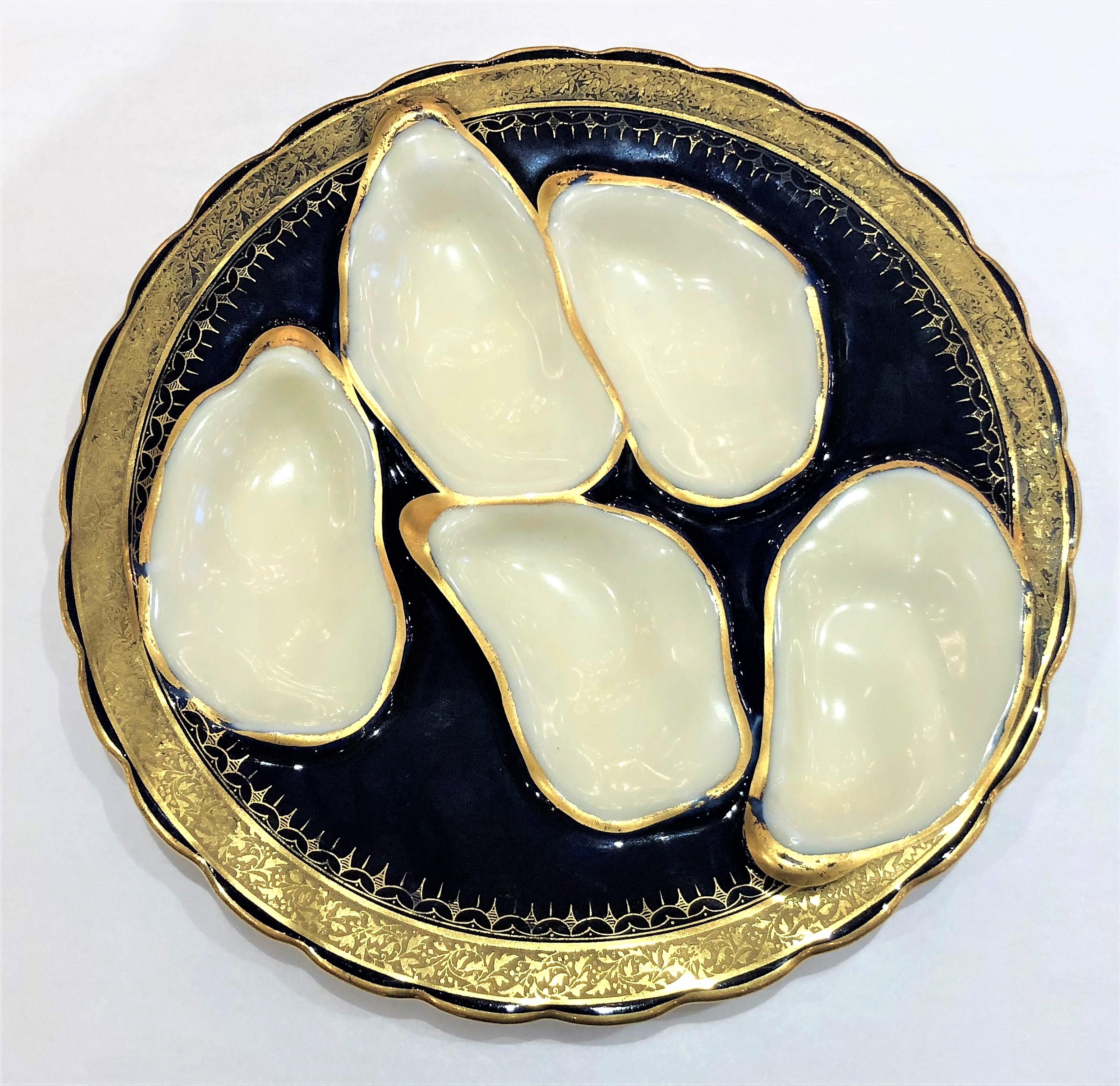 Antique French hand-painted Limoges porcelain oyster plate, circa 1870-1880.