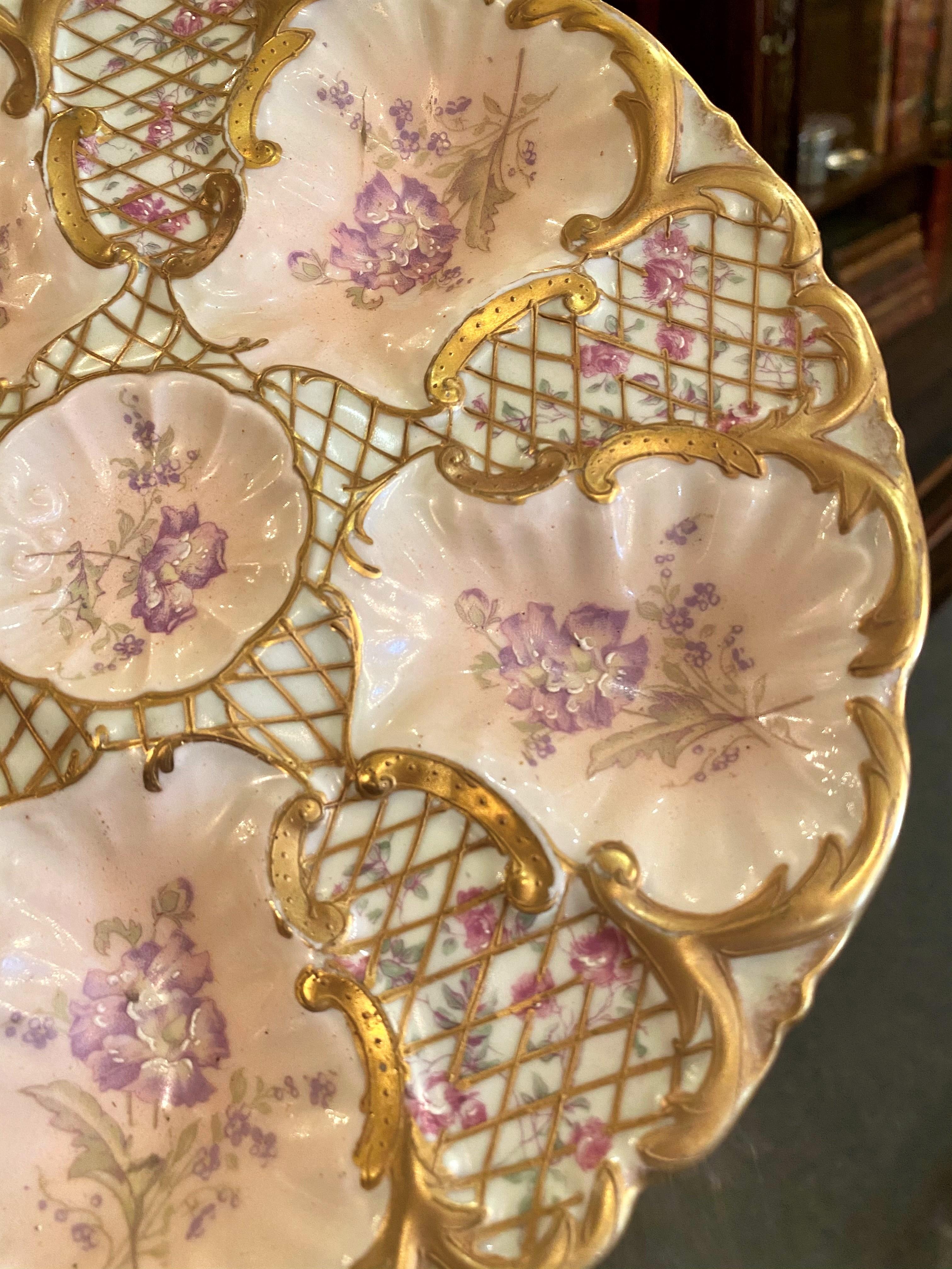 Antique French hand painted blush pink, pale green, violet and gold netted Limoges porcelain oyster plate signed 