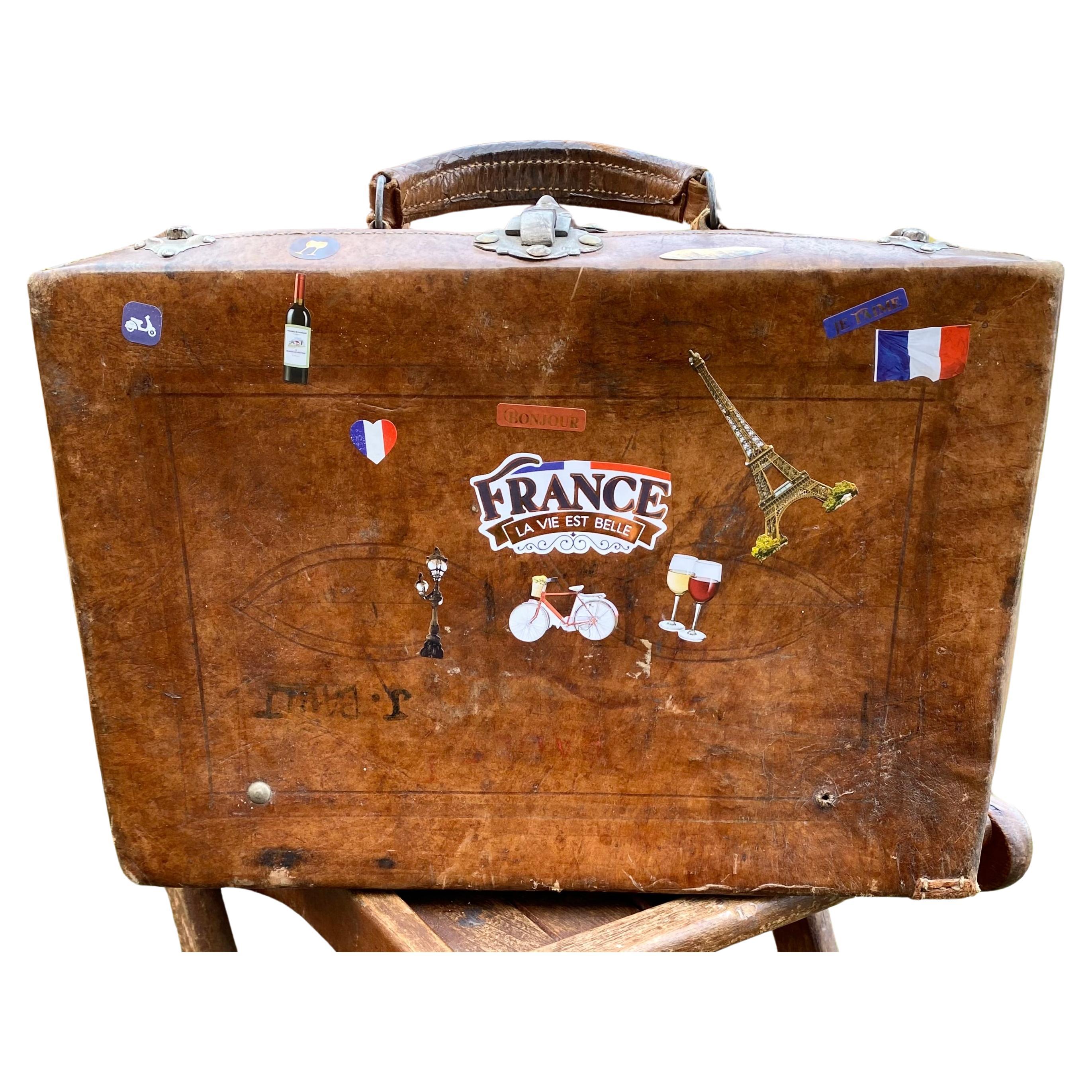 Early 1900s Antique Thick Cowhide Leather Suitcase With Solid Brass Hardware. It is Completely Hand Made - Hand Stitched - Constructed out of Thick - Heavy Gauge Cowhide Leather. It was Made in Franch. The Latches and Locking Mechanism ( Key Not
