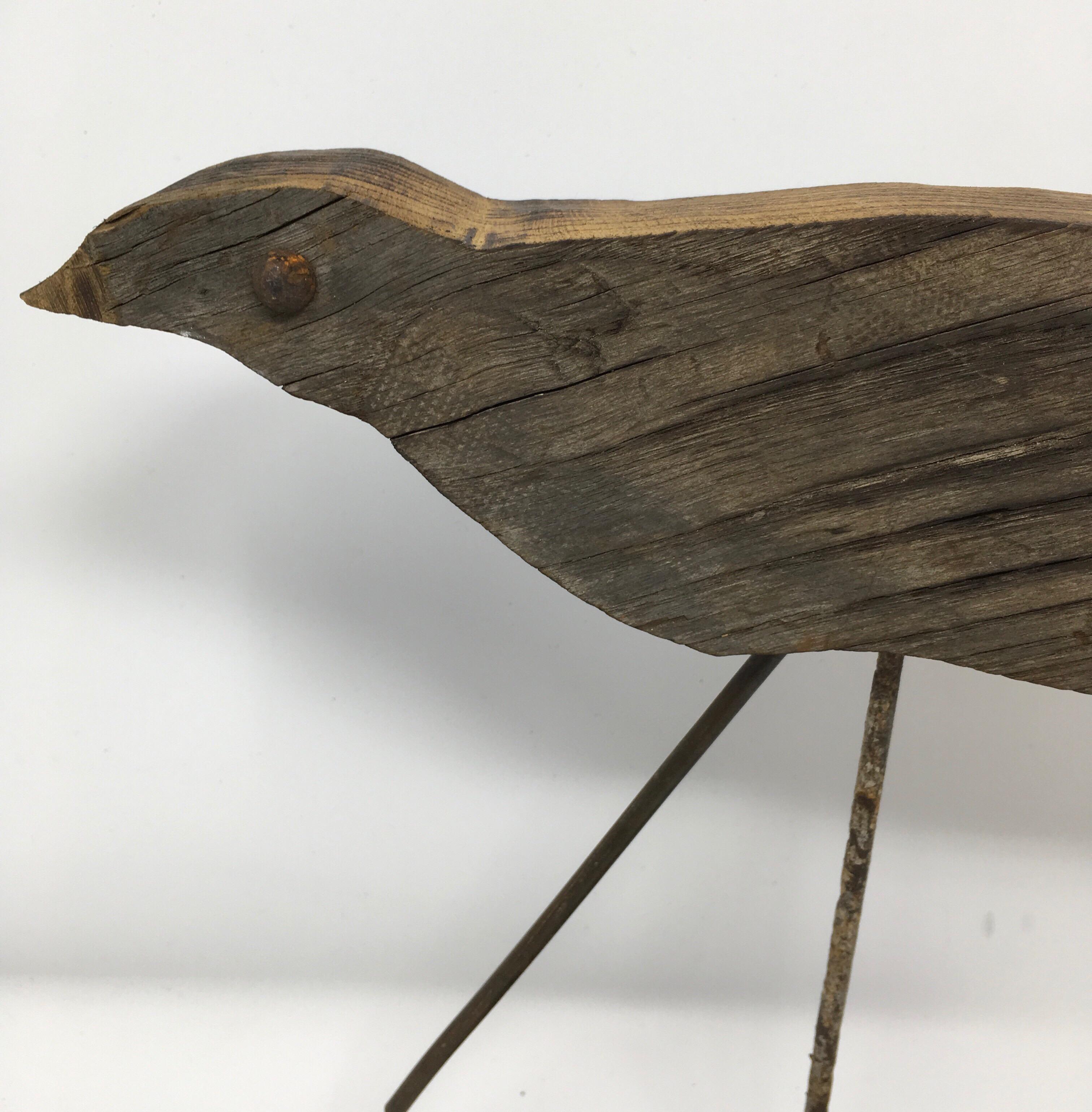 Found in the Provence Region of France, this antique handmade Bird Decoy is mounted on a new custom iron base. The eyes on this decoy are constructed with metal rivets. Today, these types of bird decoys add interest displayed on tables and