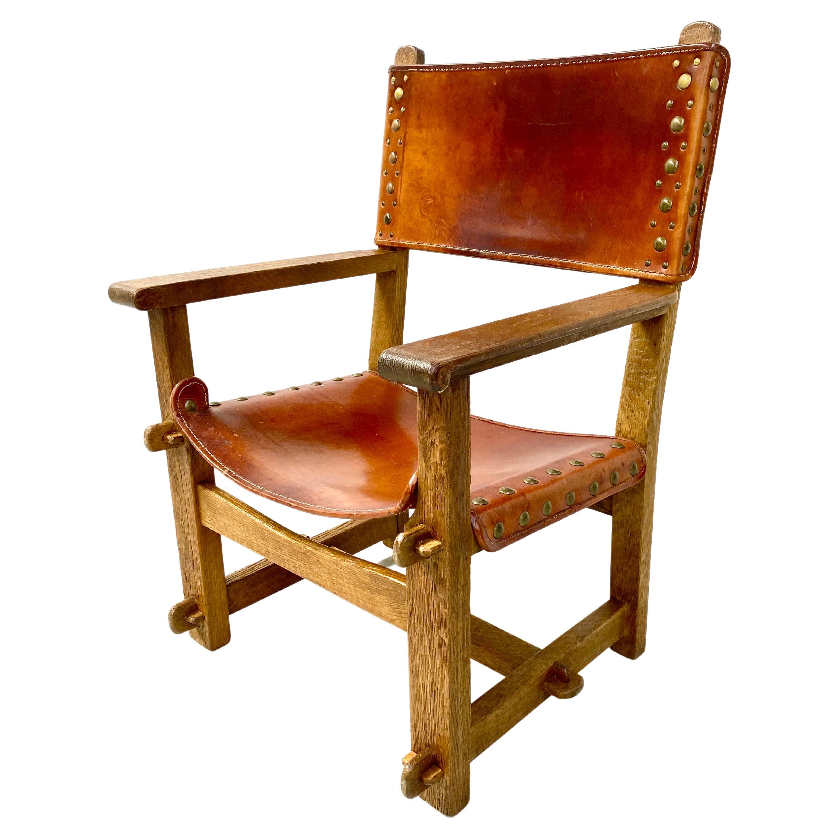 Antiker französischer handgefertigter brutalistischer Schloss-Sessel aus Eiche und Cognacleder, 1920er Jahre