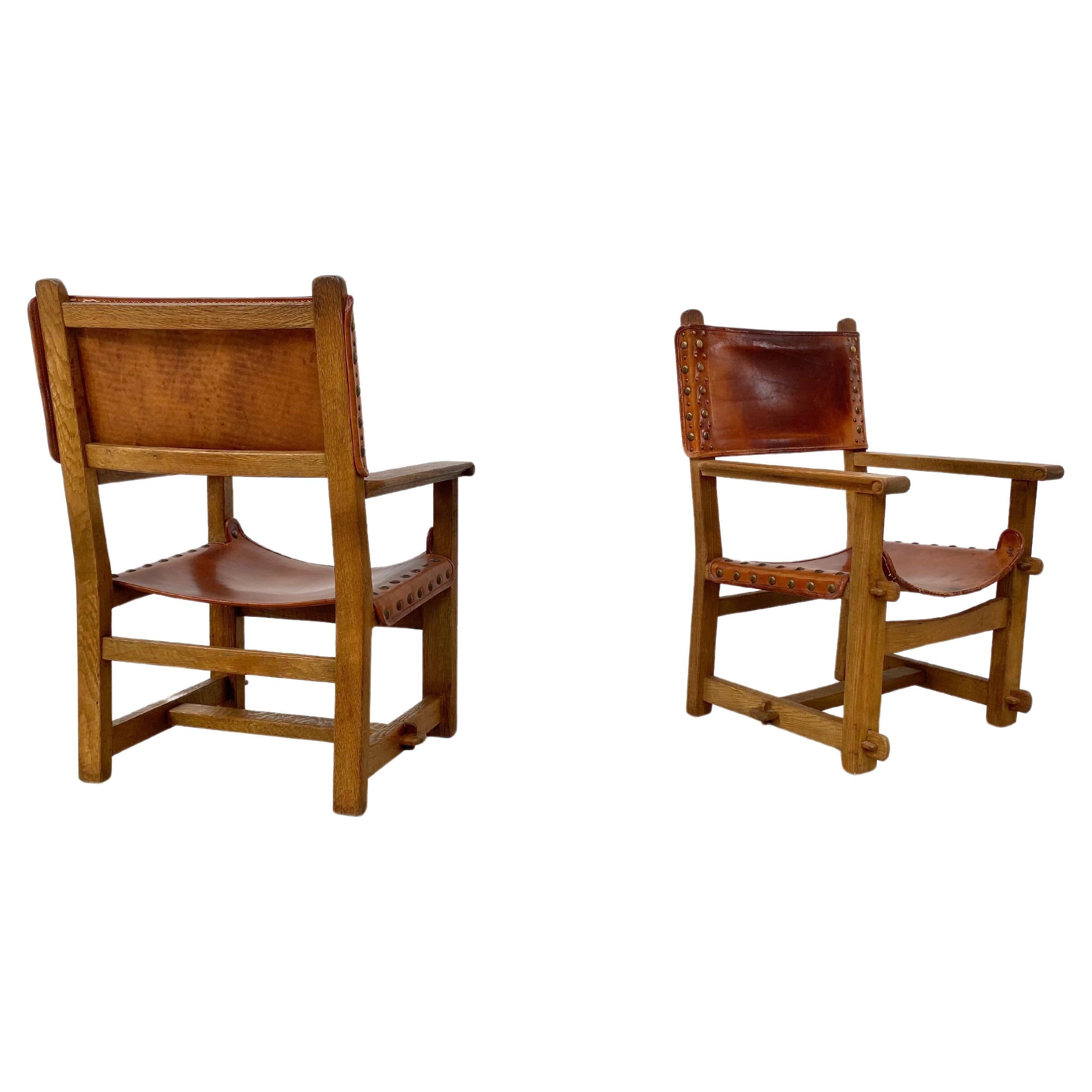 20th Century Antique French Handmade Brutalist Oak & Cognac Leather Castle Chairs, 1920s. For Sale