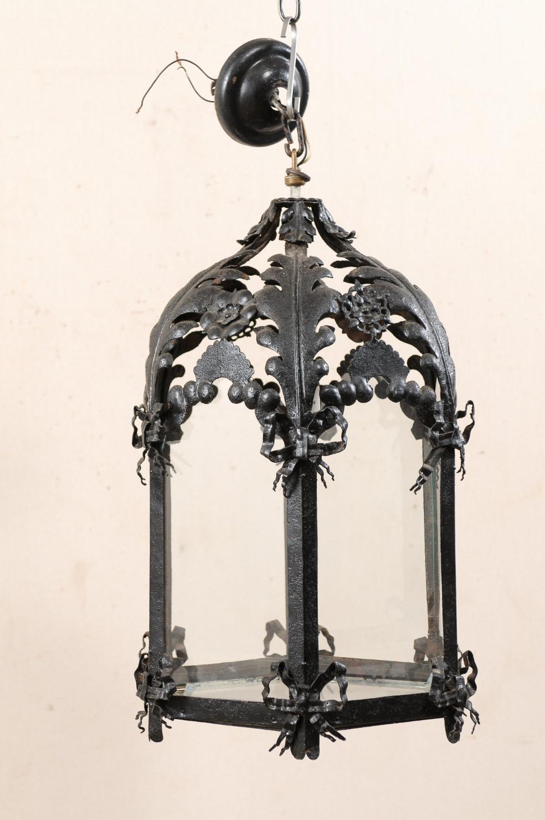20th Century Antique French Hanging Black Iron Lantern with Ribbon and Floral Motif
