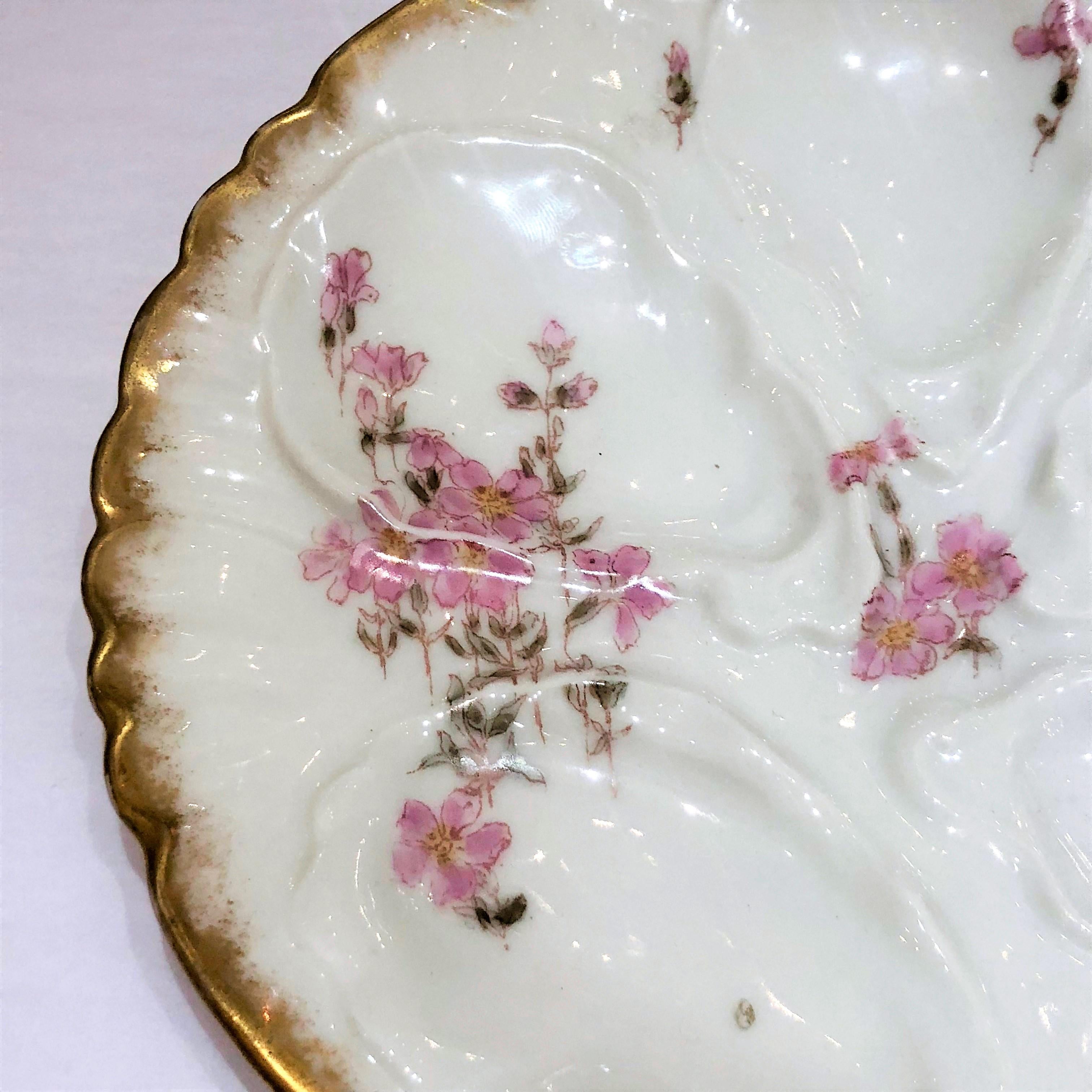 Antique French Haviland Limoges hand-painted porcelain oyster plate, circa 1890.