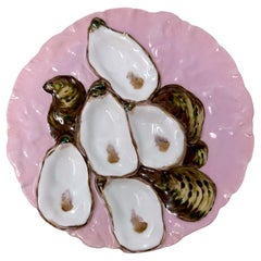 Ancienne assiette à huîtres Haviland en porcelaine de Limoges à motif de dinde rose.