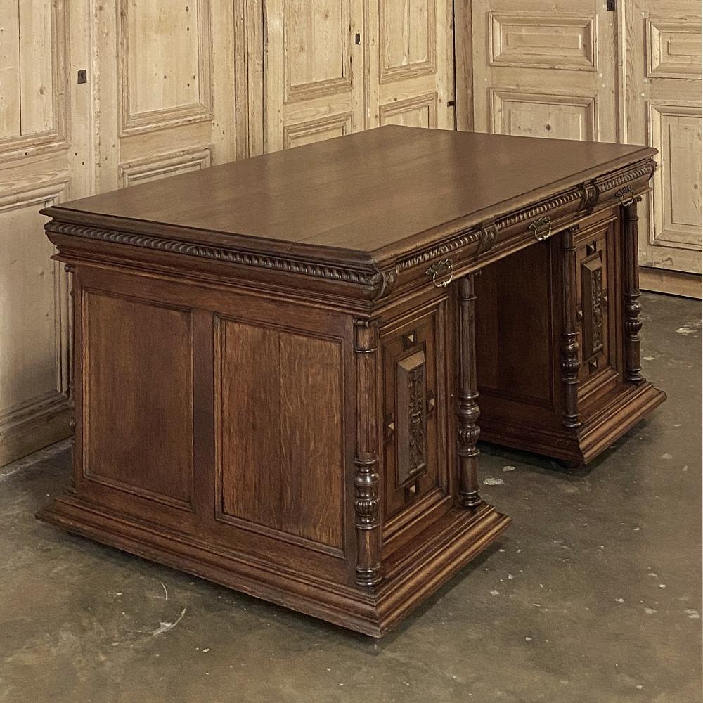 Antique French Henri II Partner's desk was hand-crafted from dense, old-growth oak, and features a spacious top that can be shared by two! Three drawers and two cabinets on each side provide equal workspace and storage access. The design is easy to