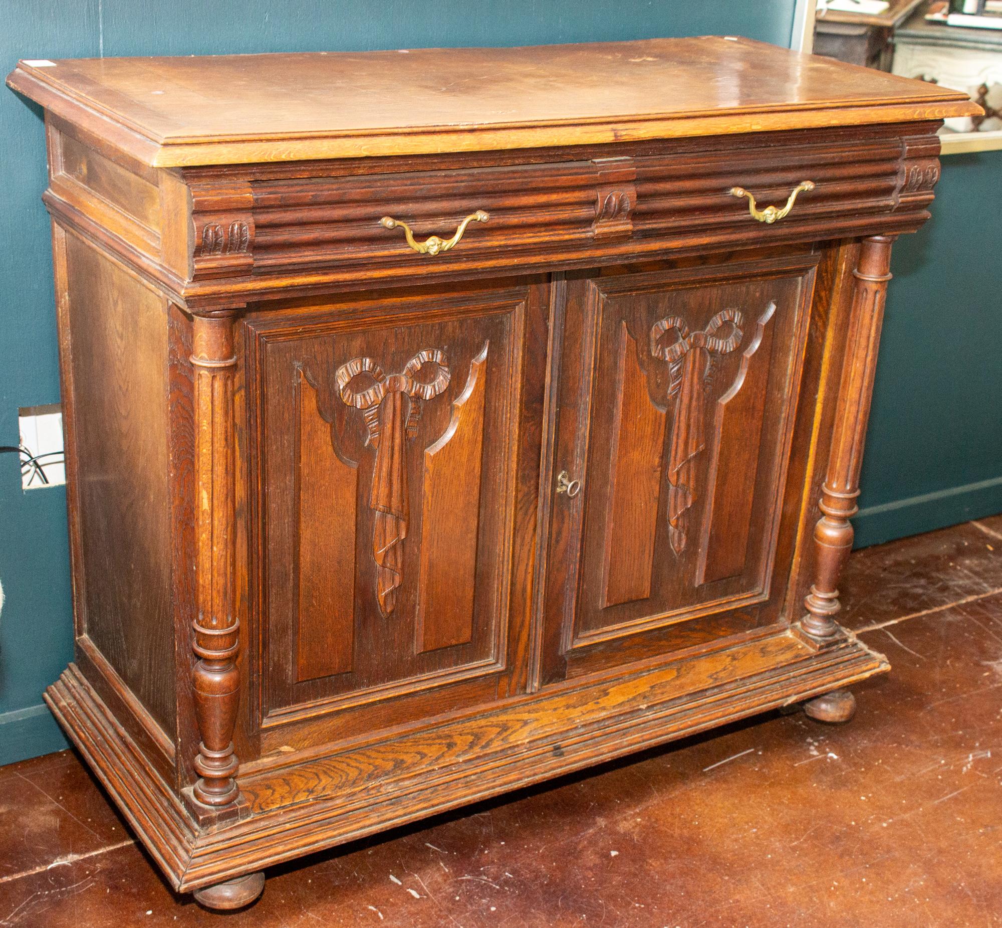 Neoclassical Revival Antique French Henri II Style Oak Carved Buffet with Carved Bow Detail For Sale