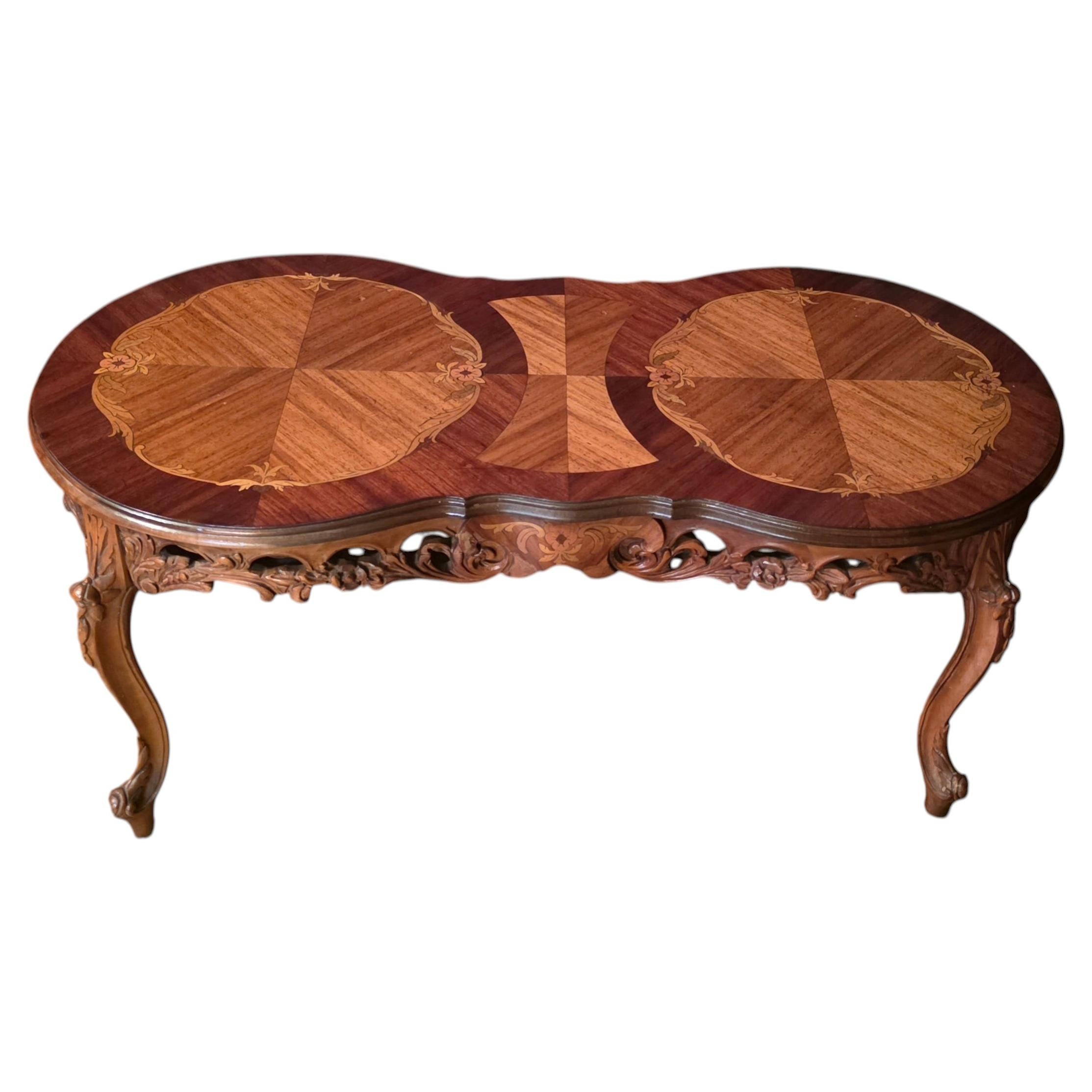 Antique Hourglass Coffee Table with Wood Inlays and Scrollwork Carving