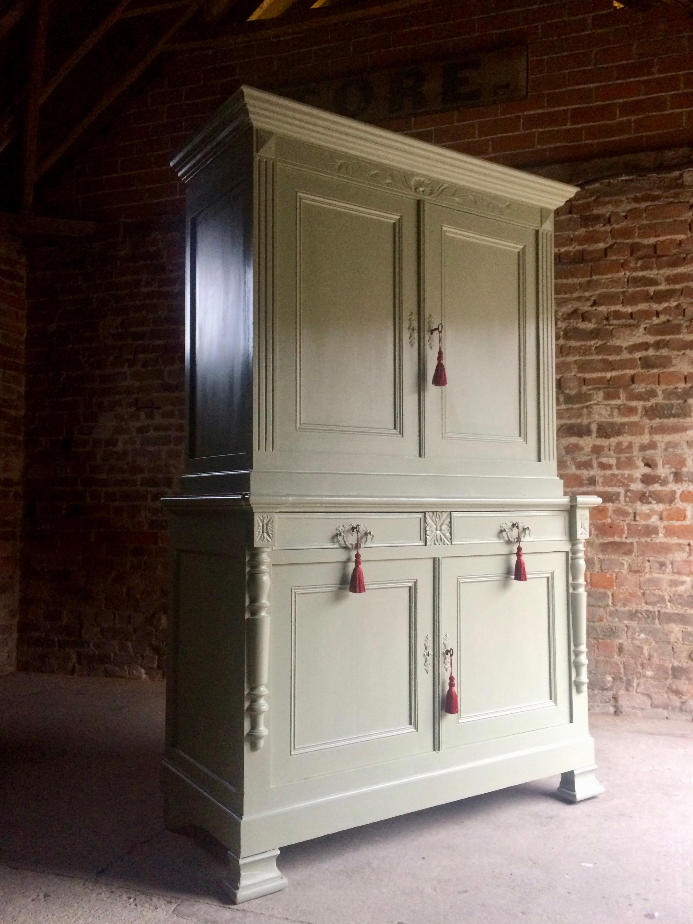 A magnificent large and imposing antique 19th century French oak housekeepers cupboard buffet circa 1870, the moulded overhanging cornice above two panelled doors, enclosing shelves, over two frieze drawers above two cupboard doors enclosing shelves