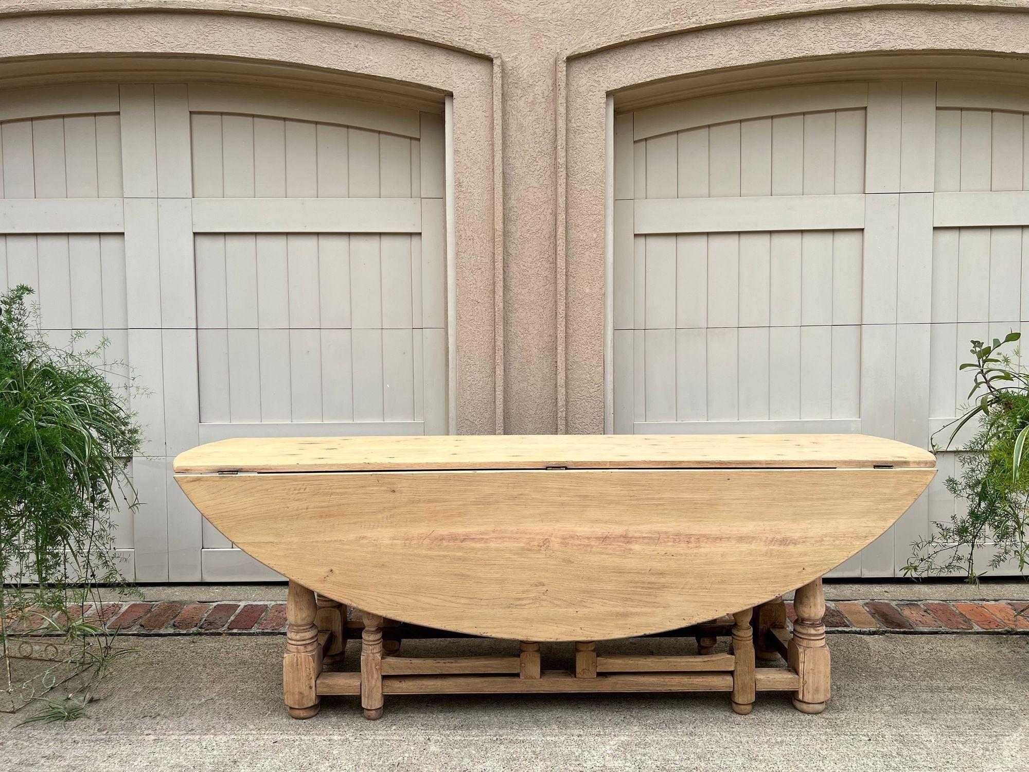 Antique French Hunt Wake DINING Table Bleached Oak LARGE Gate Leg Console c1880.

Direct from France, and an extremely sought-after table design, this very large, drop leaf, gate leg “wake” or “hunt” table is a beautiful example of versatility and