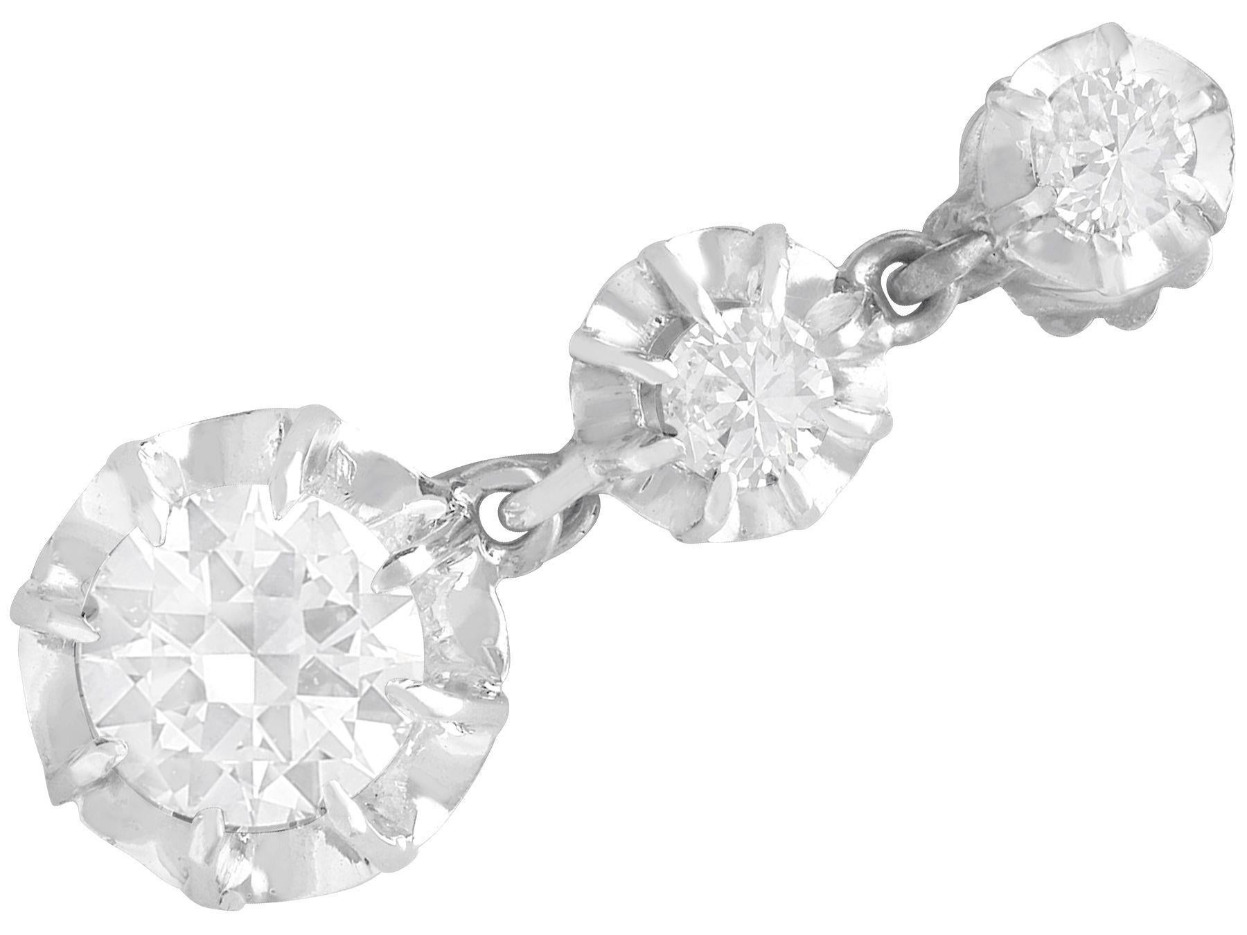 A stunning, fine and impressive pair of antique 1.81 carat diamond and platinum earrings; part of our diverse diamond jewelry and estate jewelry

These stunning antique earrings have been crafted in platinum with 18k white gold fittings.

These