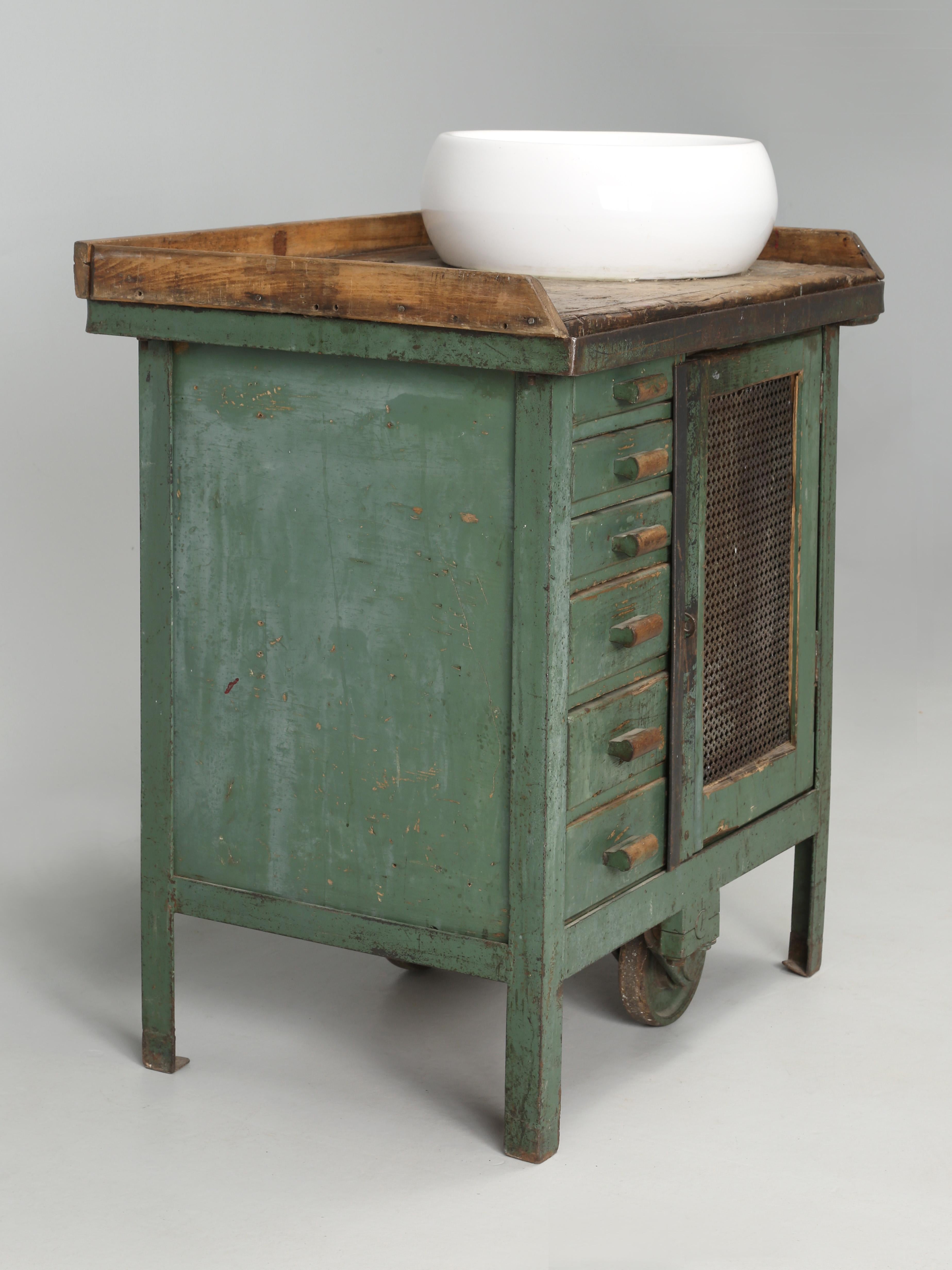 Interesting antique French Industrial cabinet that was probably used at a railroad yard around 1900. Someone started to convert the industrial work cabinet into a bathroom vanity and it's still not too late to either change it back or pick out a