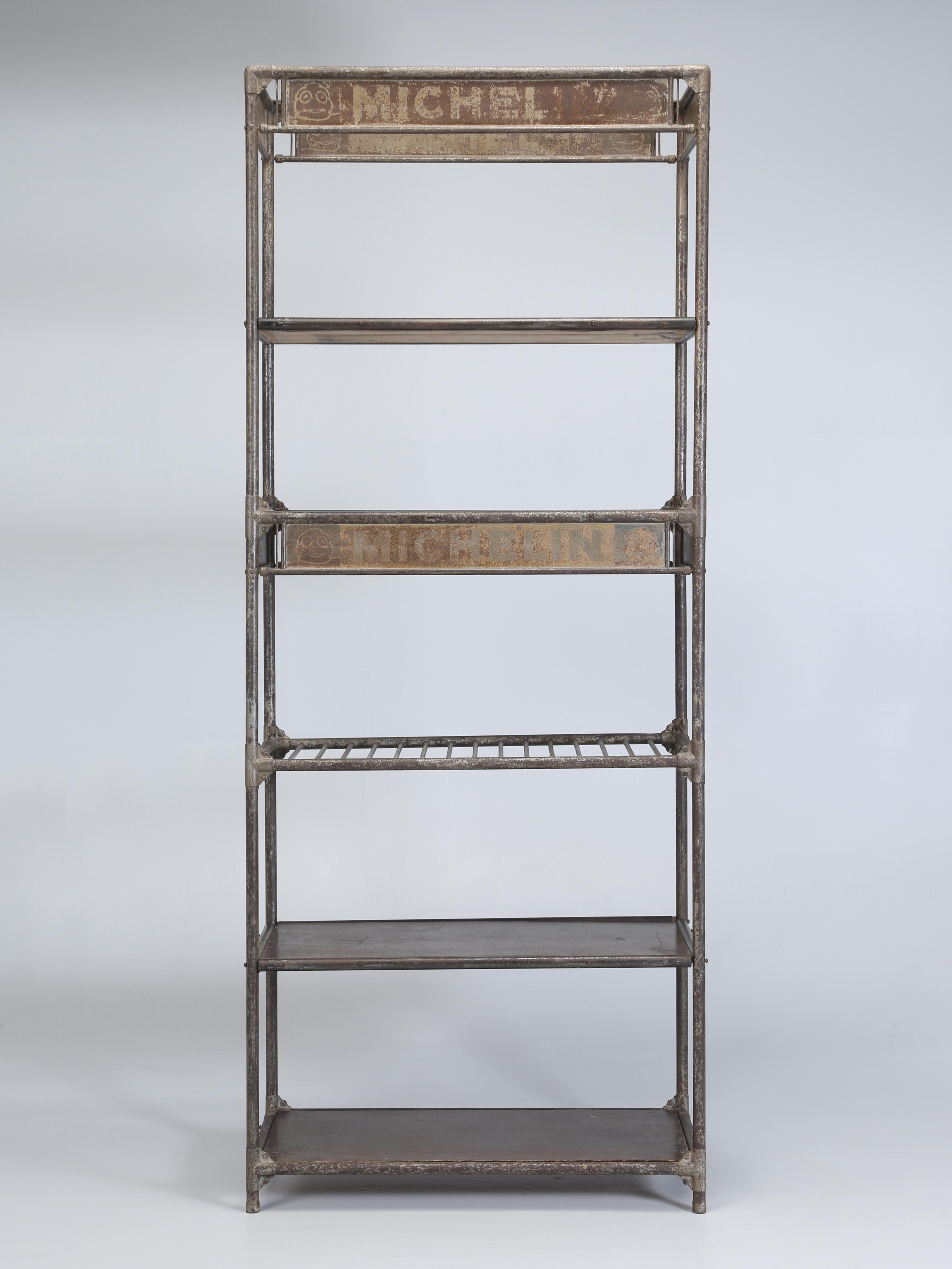 Antique French Industrial Steel Shelf Unit (étagère since it is French) probably made for a Michelin Tire dealer between 1900 and 1920. We deliberately chose to leave the étagère in its all-original finish, for the Michelin lettering and Michelin