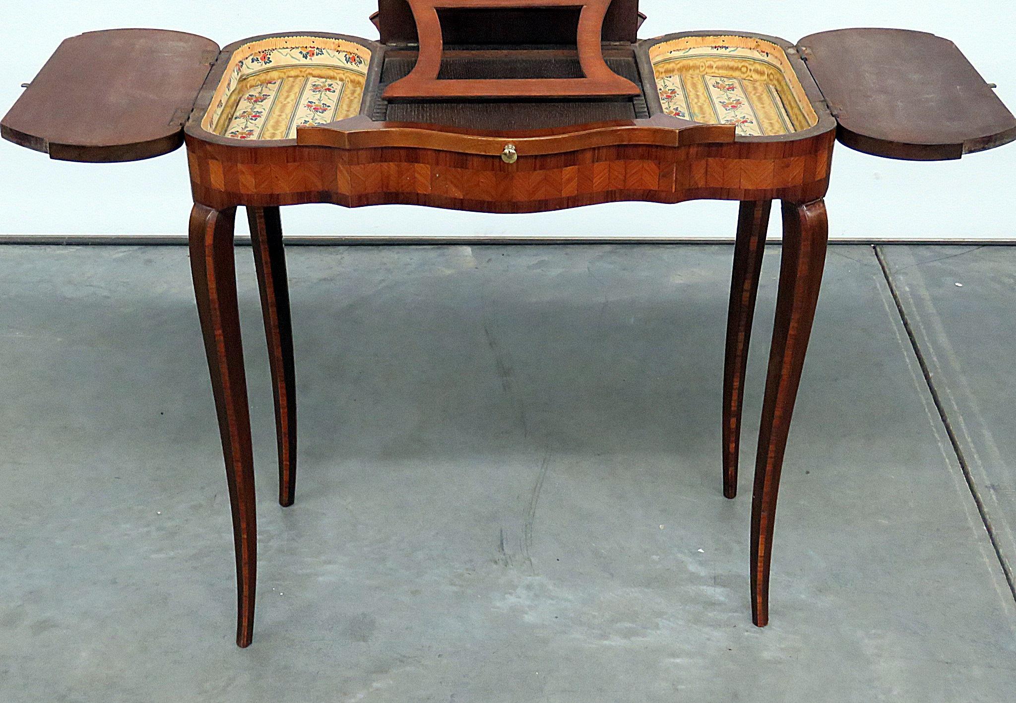 Antique French inlaid ladies desk or ladies vanity with pull up storage and 2 side compartments.