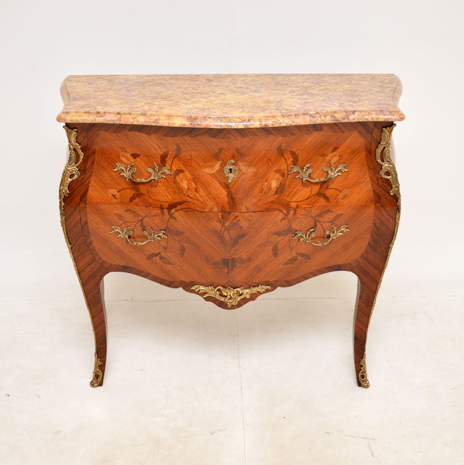 A stunning antique French marble top bombe commode with an amazing original marble top. This was made in France and dates from around the 1890-1900 period.

It is of superb quality and is made from various woods inlaid into gorgeous patterns. The