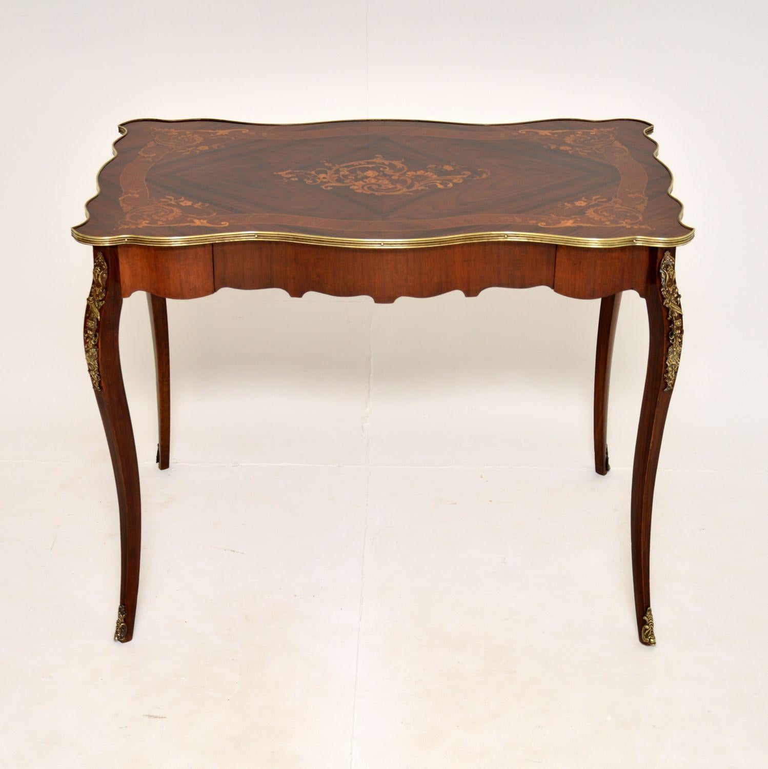 A beautiful and very elegant antique French writing table-desk made from various woods. This was made in France, it dates from around the 1880-1900 period.

It is really well made and has a gorgeous, shapely design. It is finished on all sides, so