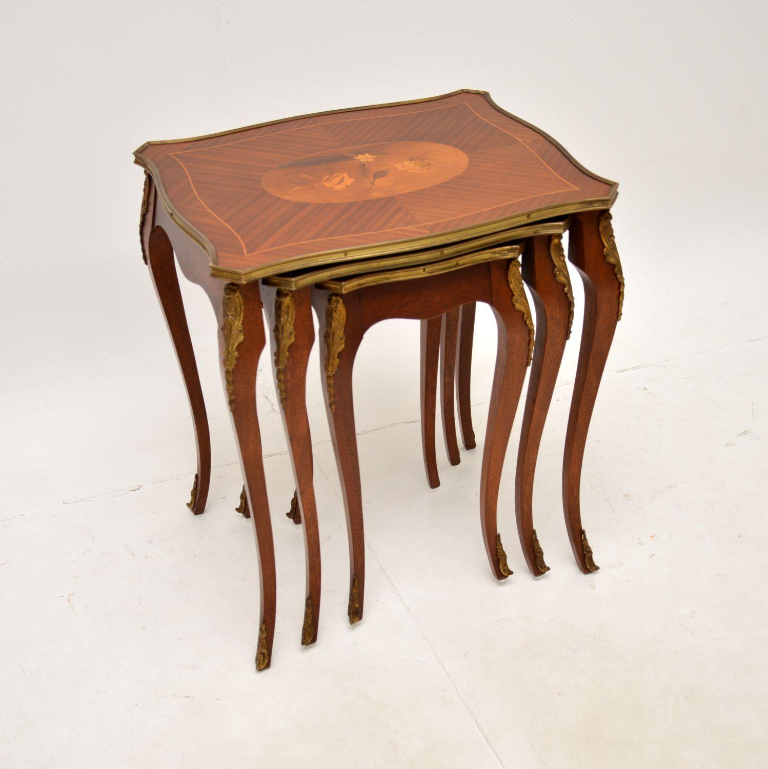 A stunning antique French inlaid nest of tables. This was made in France, it dates from around the 1930’s.

The quality is fantastic, this is beautifully made with gorgeous inlays on the tops, made from various woods. The table tops have brass rims