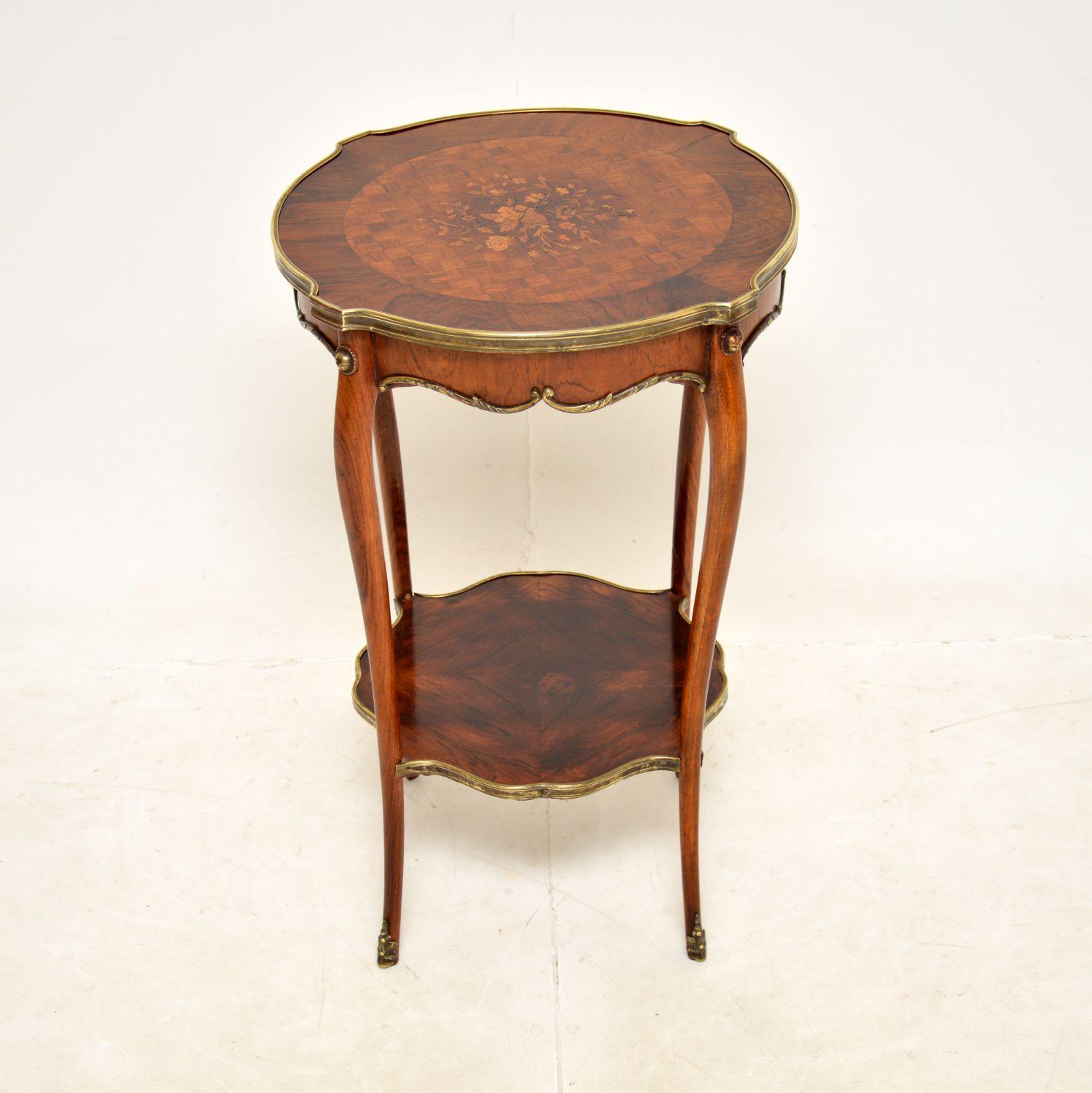 A beautiful antique French occasional side table, dating from around the 1880-1890 period.

This is of extremely fine quality, with fantastic gilt bronze mounts. The top has a cross banded edge, inlaid with gorgeous floral patterns. There is a