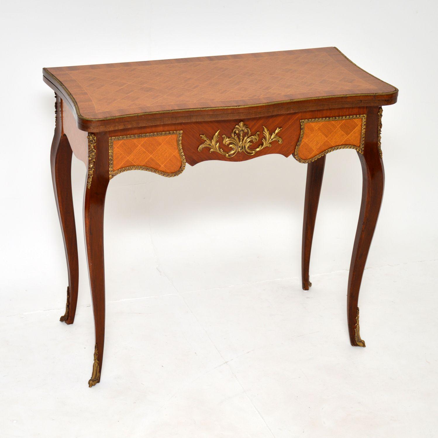 A beautiful and elegant antique French style inlaid parquetry card table, dating from around the 1930’s period.

The quality is fantastic and this has a very clever design. The top swivels and unfolds to reveal a green baize playing surface. There