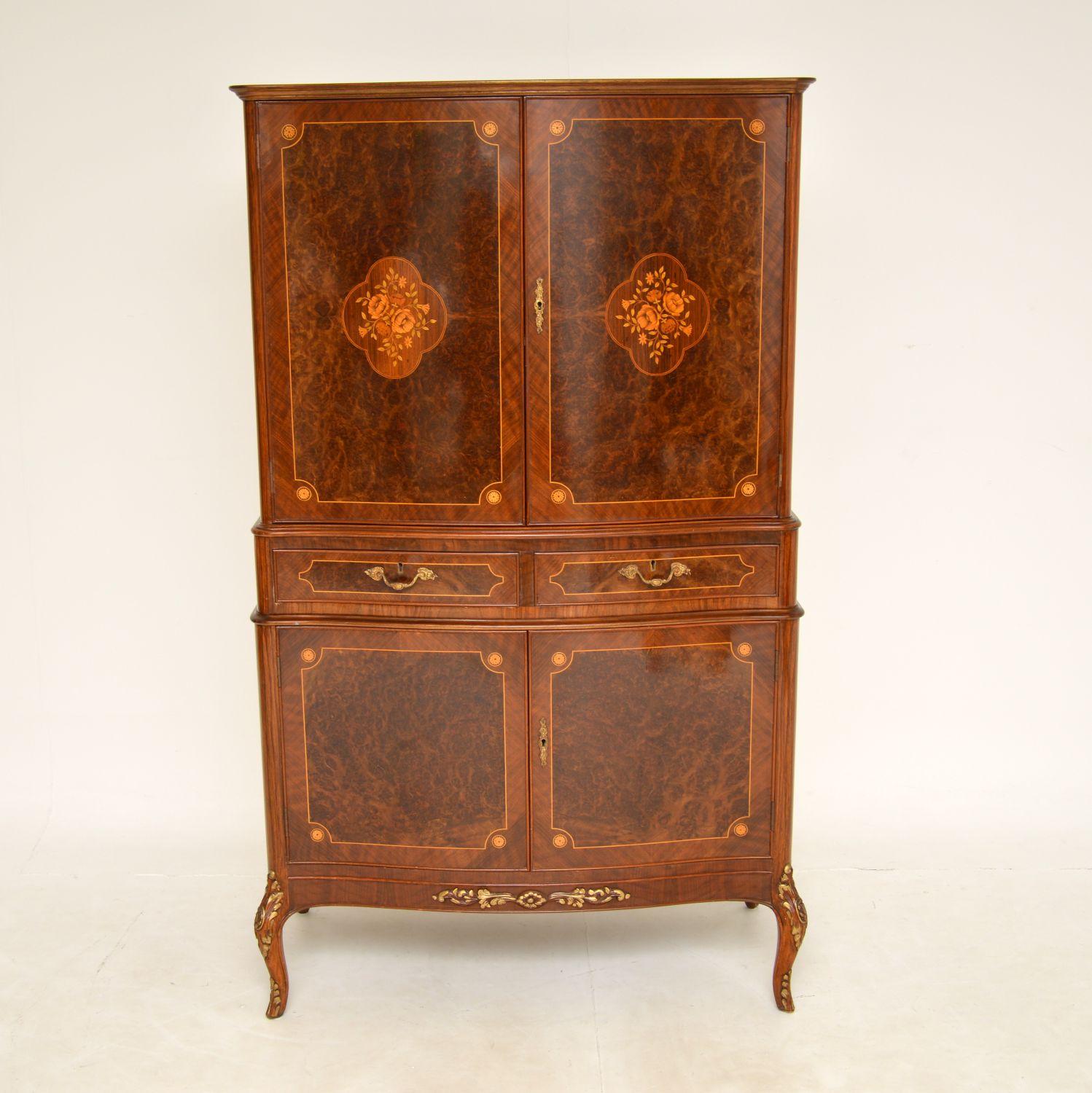 A beautiful and impressive inlaid walnut drinks cabinet in the antique French style, dating from around the 1950’s period.
The quality is amazing, this is extremely well made with many fine features. It is made from a combination of burr walnut,